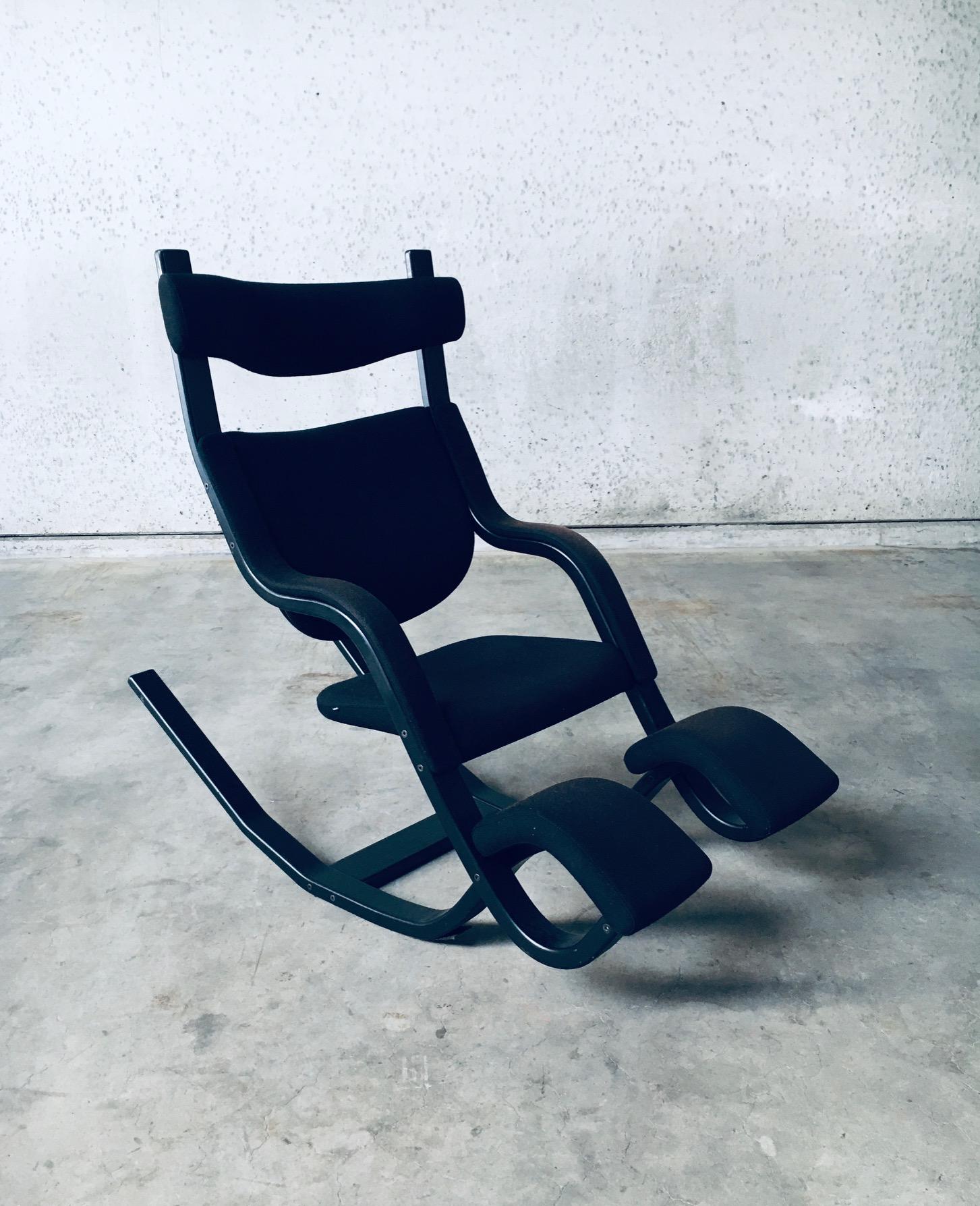 Vintage Scandinavian Ergonomical Design Balance / Rocking Chair 'ZERO GRAVITY' by Norwegian Designer Peter Opsvik for Stokke Varier. Made in Denmark, 1991 design. Black stained bentwood frame with black wool fabric. All original condition with wear