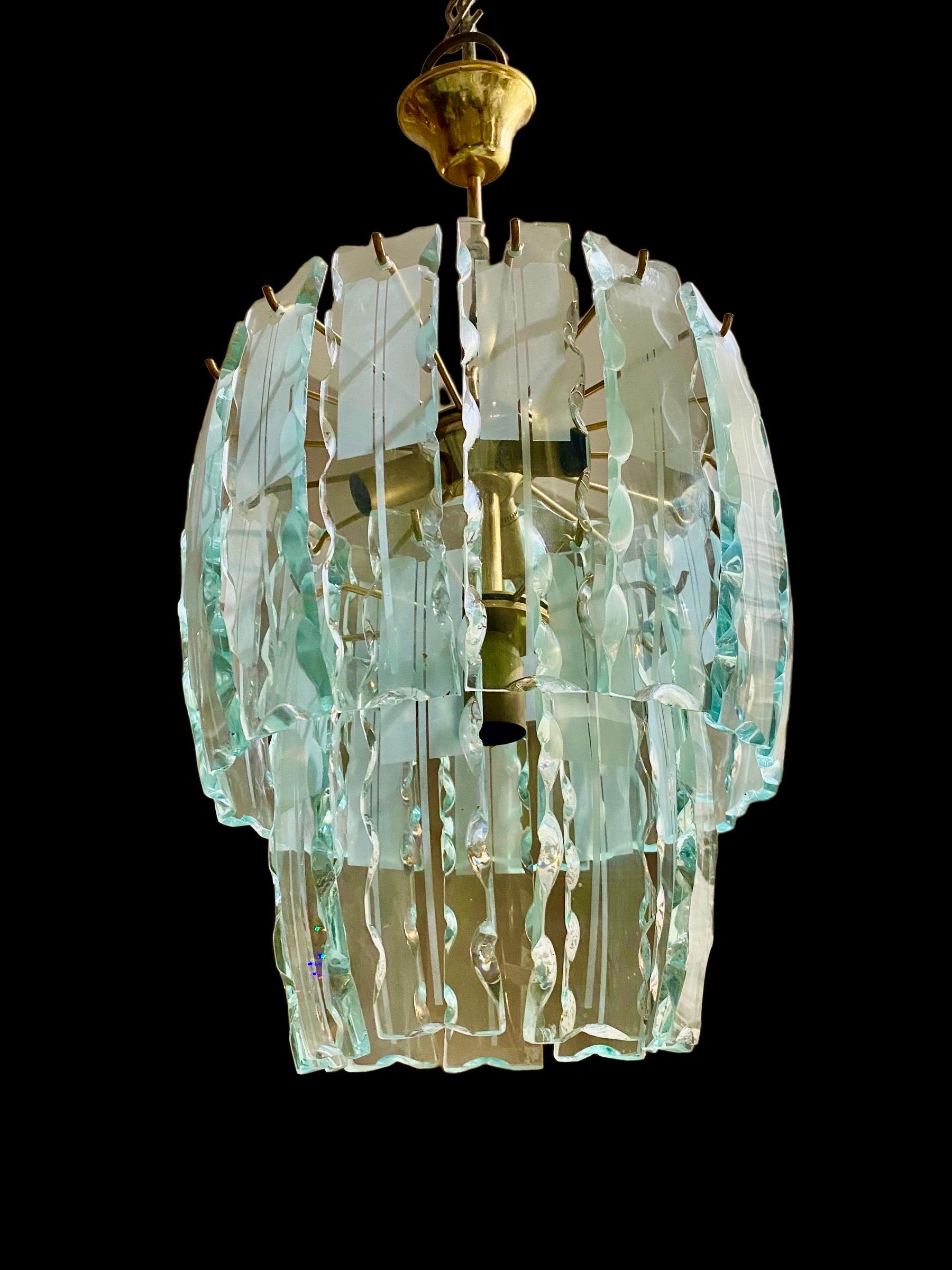 Zero Quattro glass chandelier, glass of murano in glass design. Very rare model of glass with frost finish brass structure. An iconic lamp of Italian design, a unique element for an atmosphere of great luxury .

DISCOUNT shipping for US cintinantal