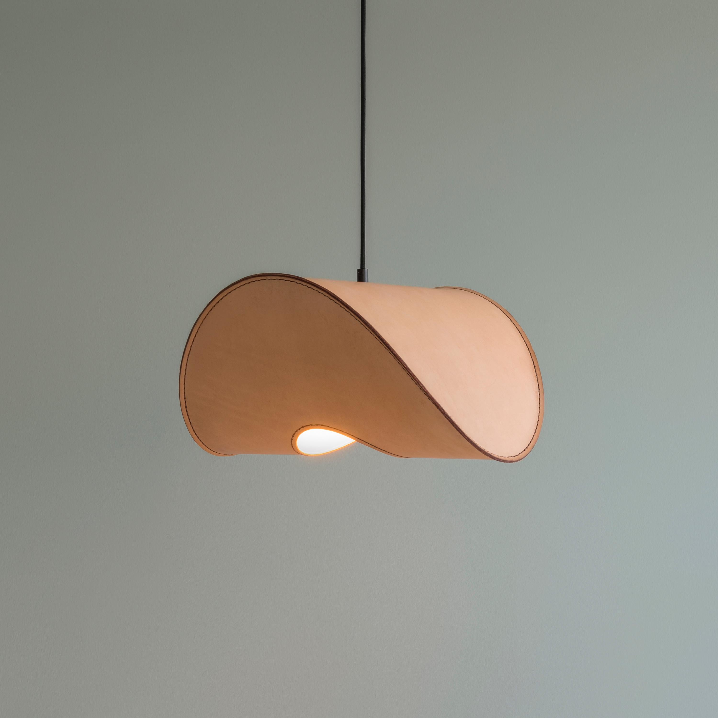 Zero Small Pendant Lamp in Vegetable Tanned Leather & Polyacetal by UNIQKA
Designed by Jacob de Baan
Dimensions: D 33 x W 33 x H 16 cm. 
Materials: Vegetable-tanned leather, paper, and steel.

Available in different colors and size options. All our