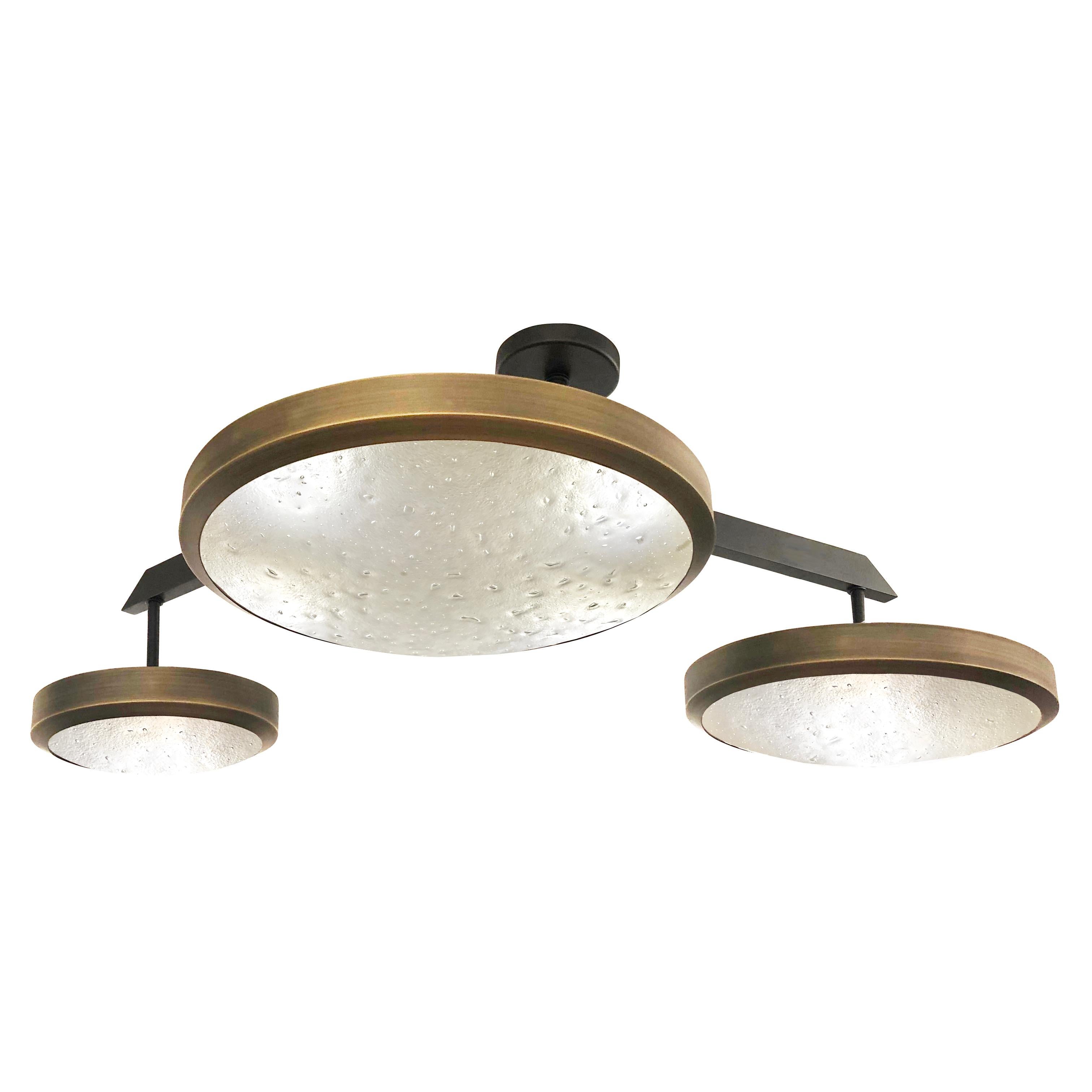 The Zeta ceiling by form A light features a composition of variable sized Murano glass shades methodically balanced on a “V” shaped brass frame. The first images show the fixture in a two-tone finish-subsequent pictures show it in a selection of