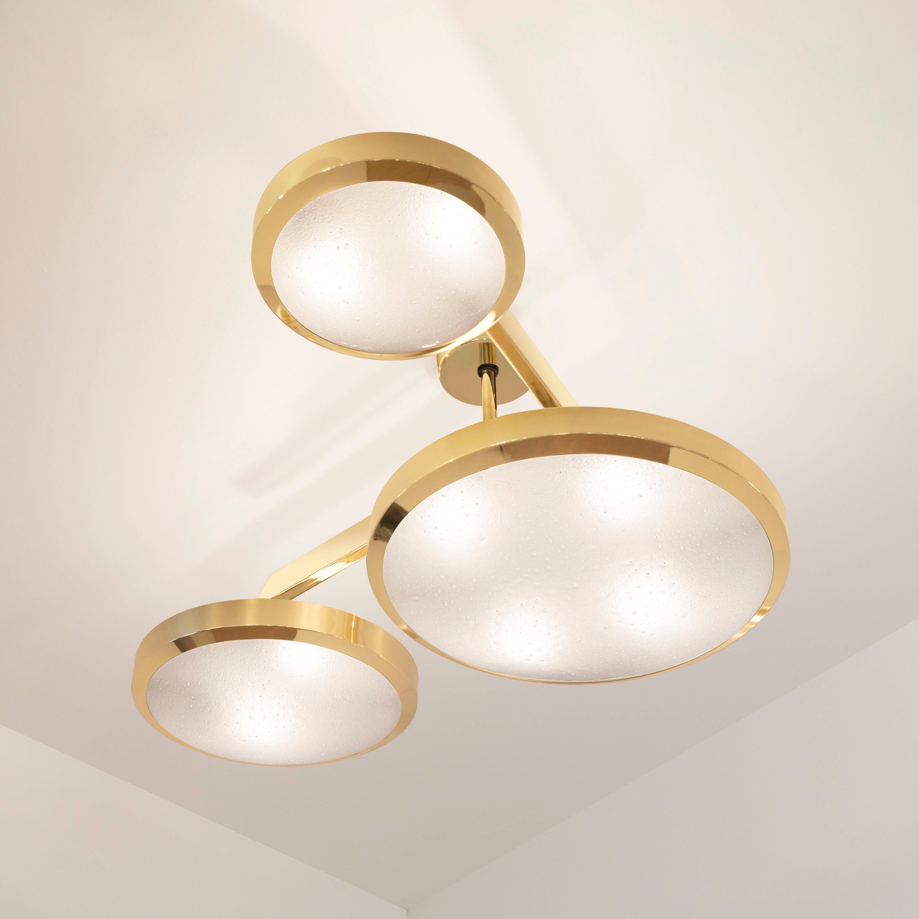 The Zeta ceiling light features a composition of variable sized Murano glass shades methodically balanced on a “V” shaped brass frame. The first images show the fixture in our polished brass finish-subsequent pictures show it in a selection of
