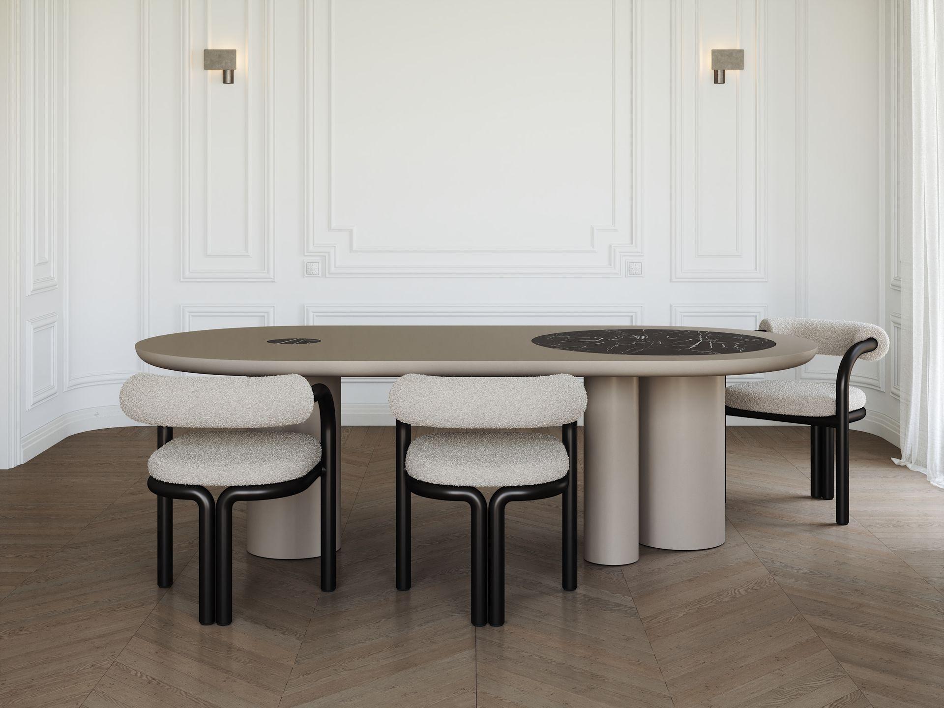 Zeus, le roi de l'Olympe et dieu du tonnerre, inspire un design d'une grandeur inégalée.
La table de salle à manger Zeus, avec son plateau ovale et ses trois pieds cylindriques, fait une déclaration audacieuse de force et d'élégance. 
La structure