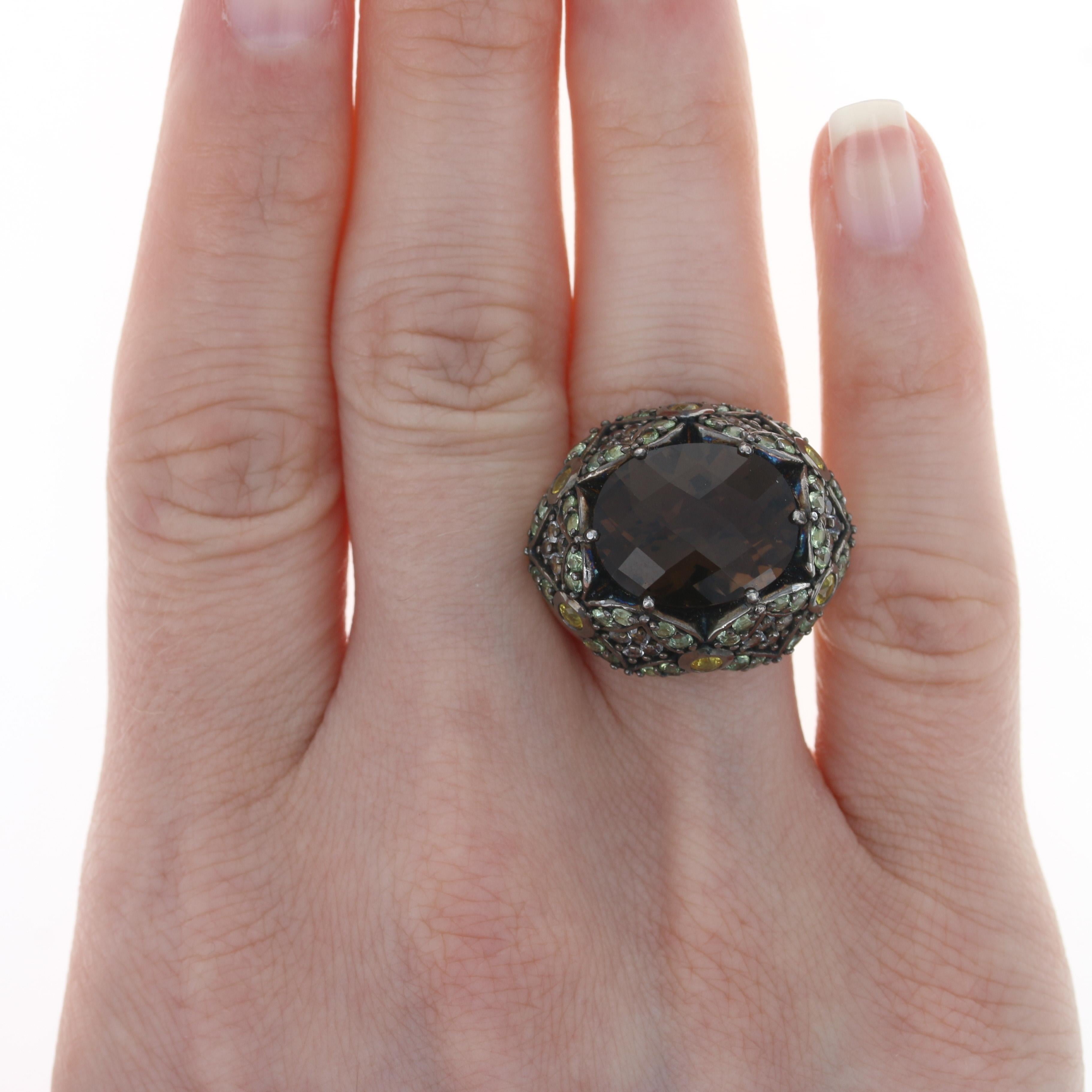 Retail Price: $1,097.50

Size: 6 3/4

Brand: Ziba by Le Vian

Metal Content: Sterling Silver

Stone Information
Genuine Smoky Quartz
Carat: 7.80ct
Cut: Oval Checkerboard
Color: Brown

Genuine Prasiolites
Carats: 1.44ctw
Cut: Round
Color: