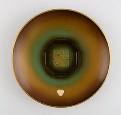 Zicu, Sweden. Two Art Deco Dishes/Bowls in Patinated Metal with Faces in Relief