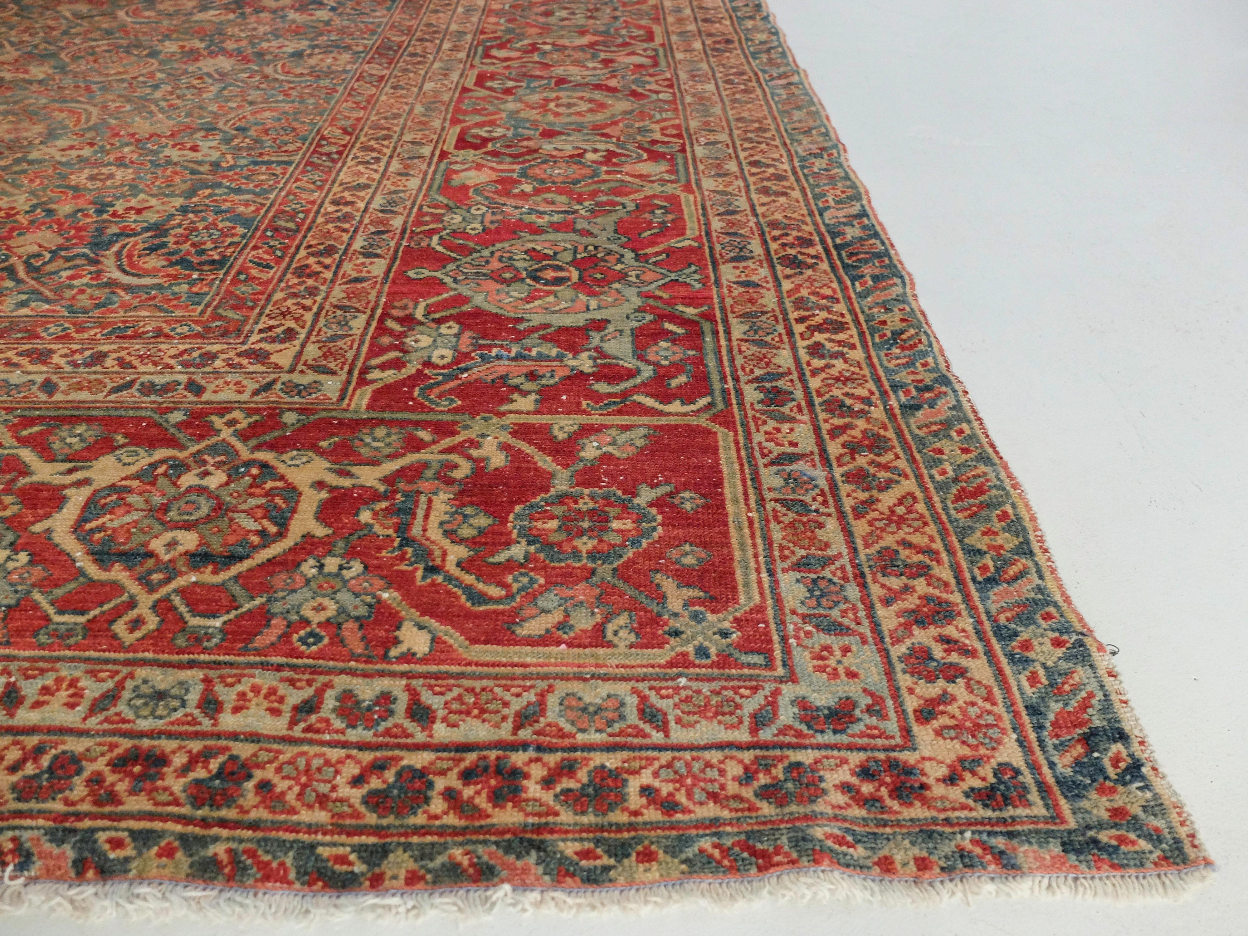 This Ziegler Mahal has an all-over design with intricate floral and natural patterns. It then has a subtle border displaying the deep red color. 

Ziegler Mahal carpets were produced by the British-Swiss Company Ziegler & Co. This style often