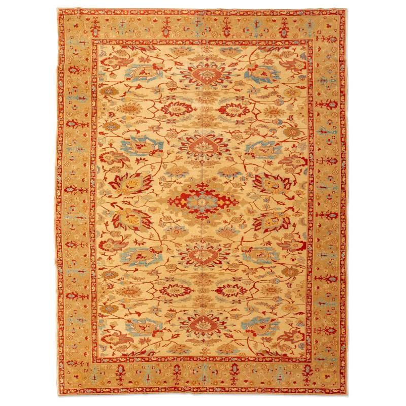 Ziegler Turkish Rug Design of palmette flowers in red and blue on a beige background in the entire field.
- The rest of the decorative elements follow linked patterns of floral figures and palmette along its border.
- Great decorative strength, and