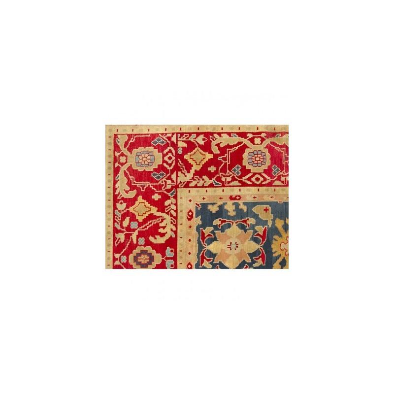Ziegler Turkish Rug Design of centerless palmette flowers on a blue background in the central field.

- The rest of the decorative elements follow linked patterns of floral figures and palmettes.

- Highlight the use of red in its border and blue
