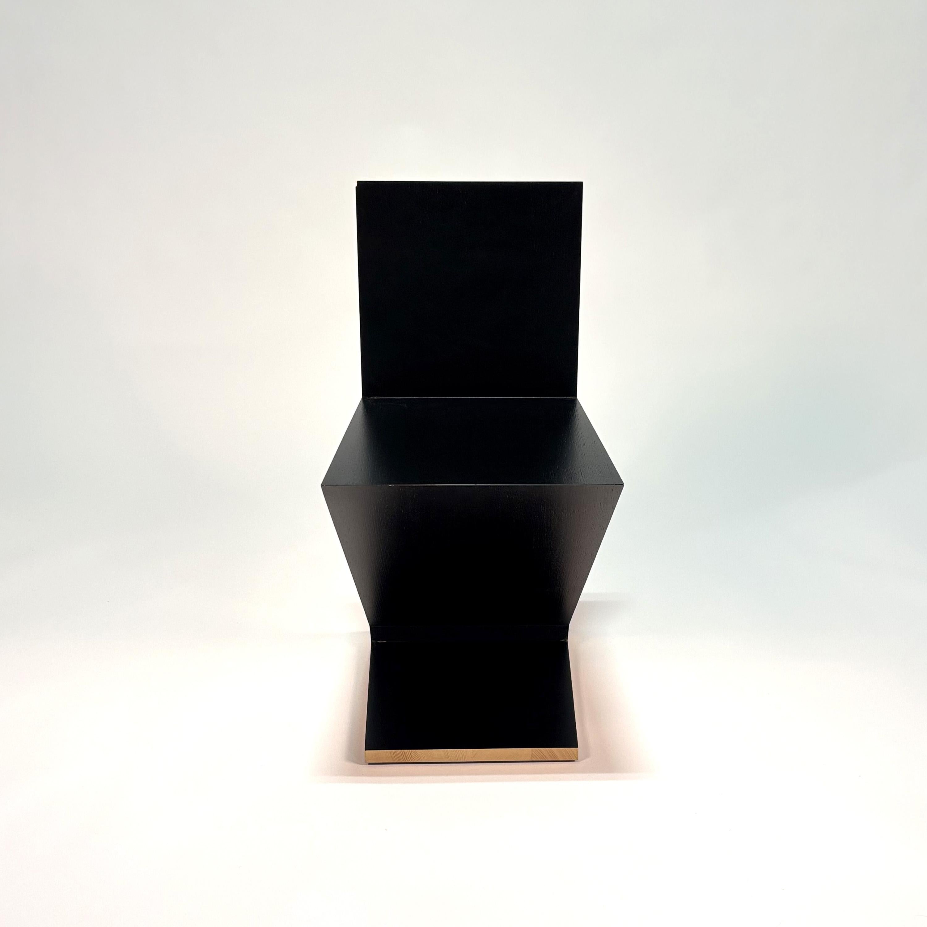 Zig Zag Chair by Gerrit Thomas Rietveld
1932 / 2022
Cassina

Open pore ashwood lacquered black. Feet in black plastic.
Produced and numbered by Cassina.