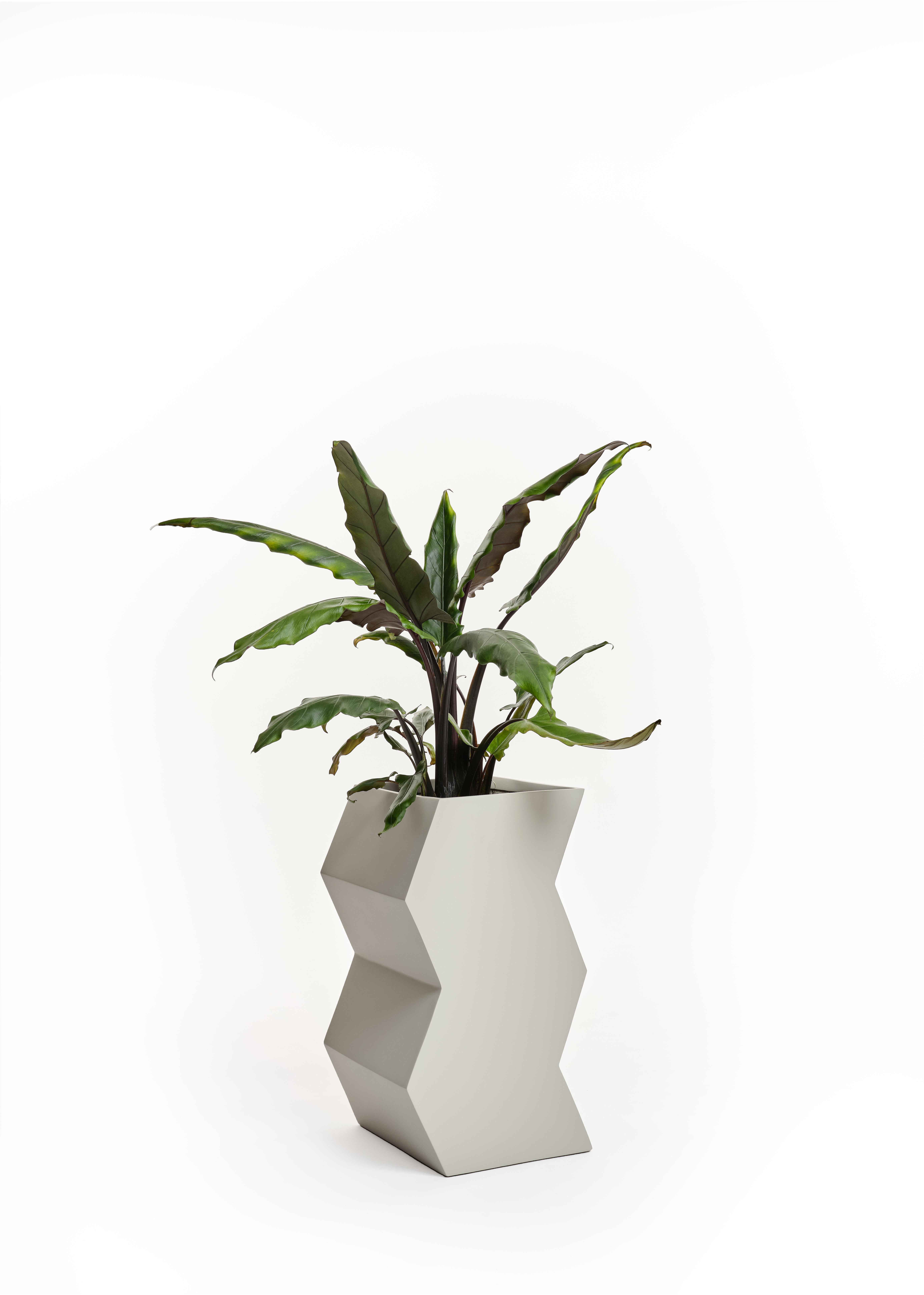 Fiberglass planters suitable for indoor or outdoor use. Made by hand in Vietnam. Lead time 8 weeks unless in stock.

Available in:
White
Mustard
Ash

Dimensions: H 22 in. x D 10 in. x W 10 in.
 