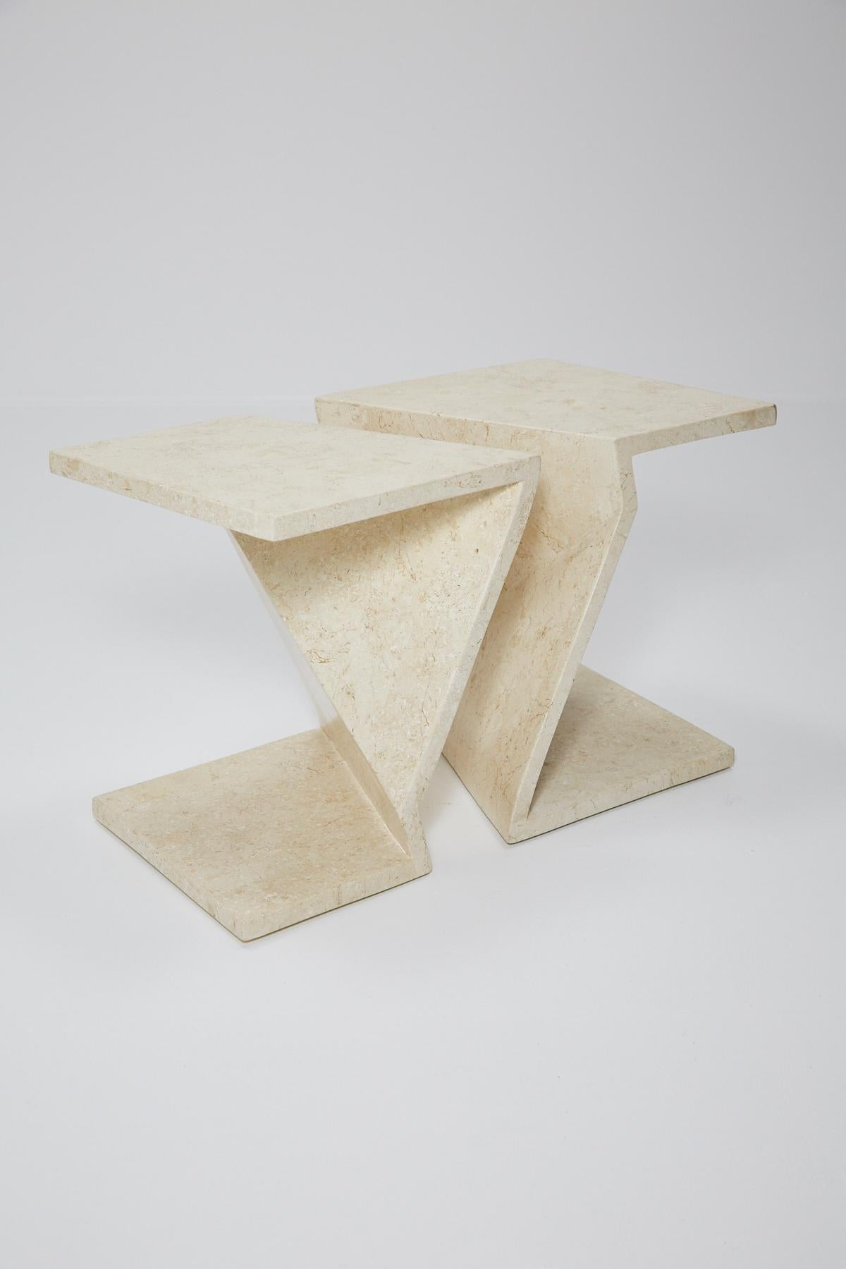 Set of two zig zag tables that can be used either as side tables or put together as a cocktail table. Tables are executed in wood, completely inlaid with white stone veneer.

Each table measures: 17 1/4 x 19 1/2 x 14 1/2 in.