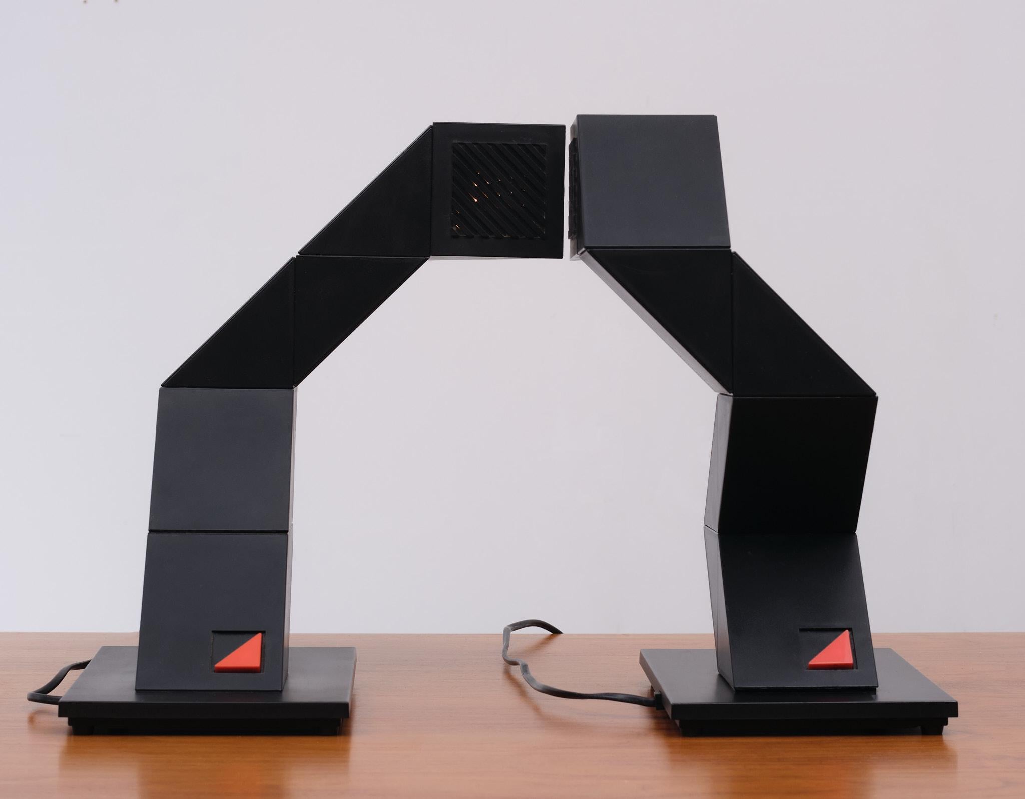 Looking for something special .What about this wonderful set of table lamps. square black plastic 
made in segments. each segment is turn-able 16 different positions each. Designer: Shui L. D. Chan in 1984.
Manufacturer: New Horizons Product