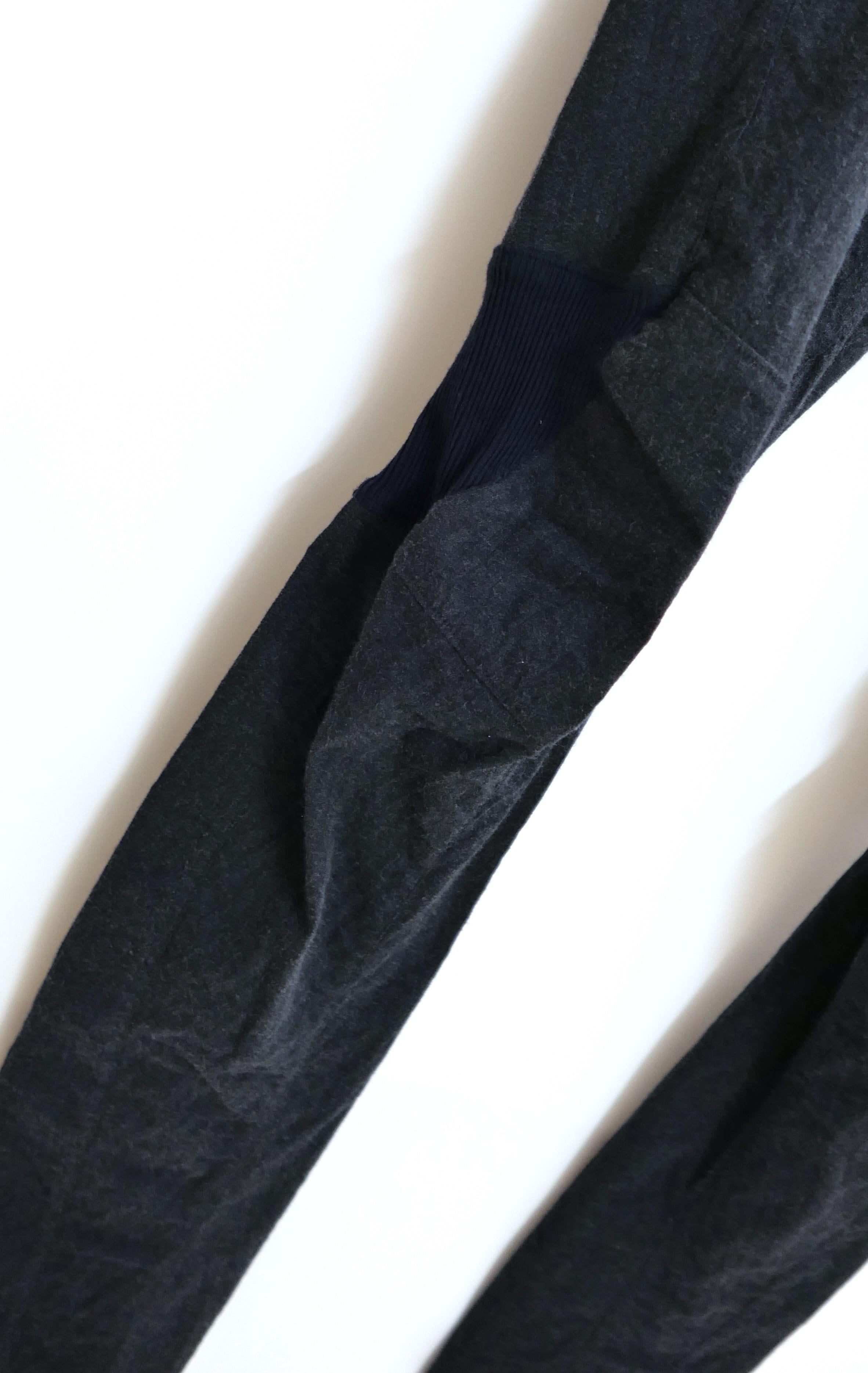 Super cool, rare Ziggy Chen pants from the Fall 2015 collection. Unworn. Made from signature washed texture blue/grey viscose, wool, linen and elastane, they have stretchy ribbed cinched panels, raw hems and slit front pockets. Size 48. Measure