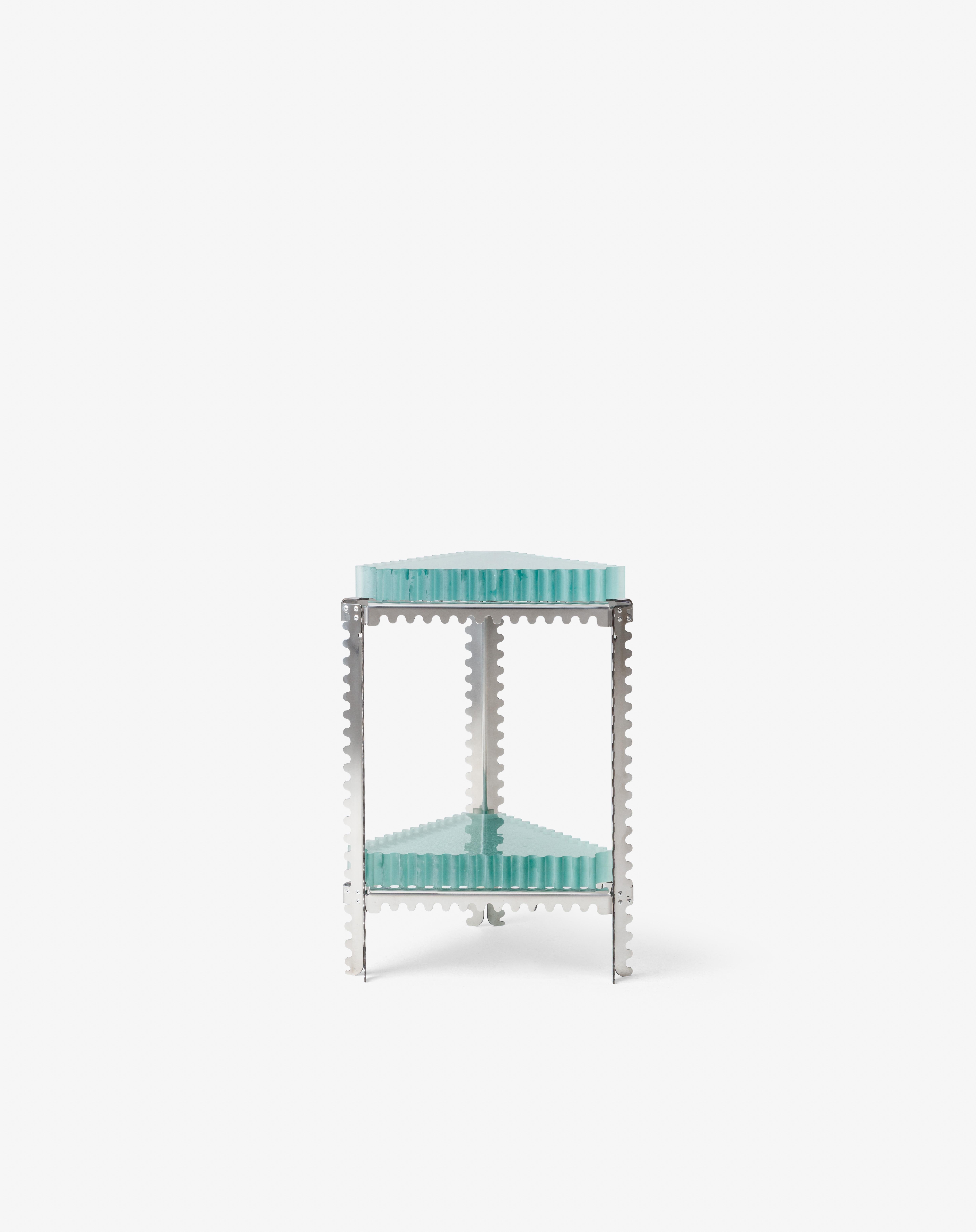 A metal structure conveys engineered tension, while translucent glass adds softness and depth—balancing weight and transparency in a single stacked form.

Listed price corresponds to editions 1 to 3.