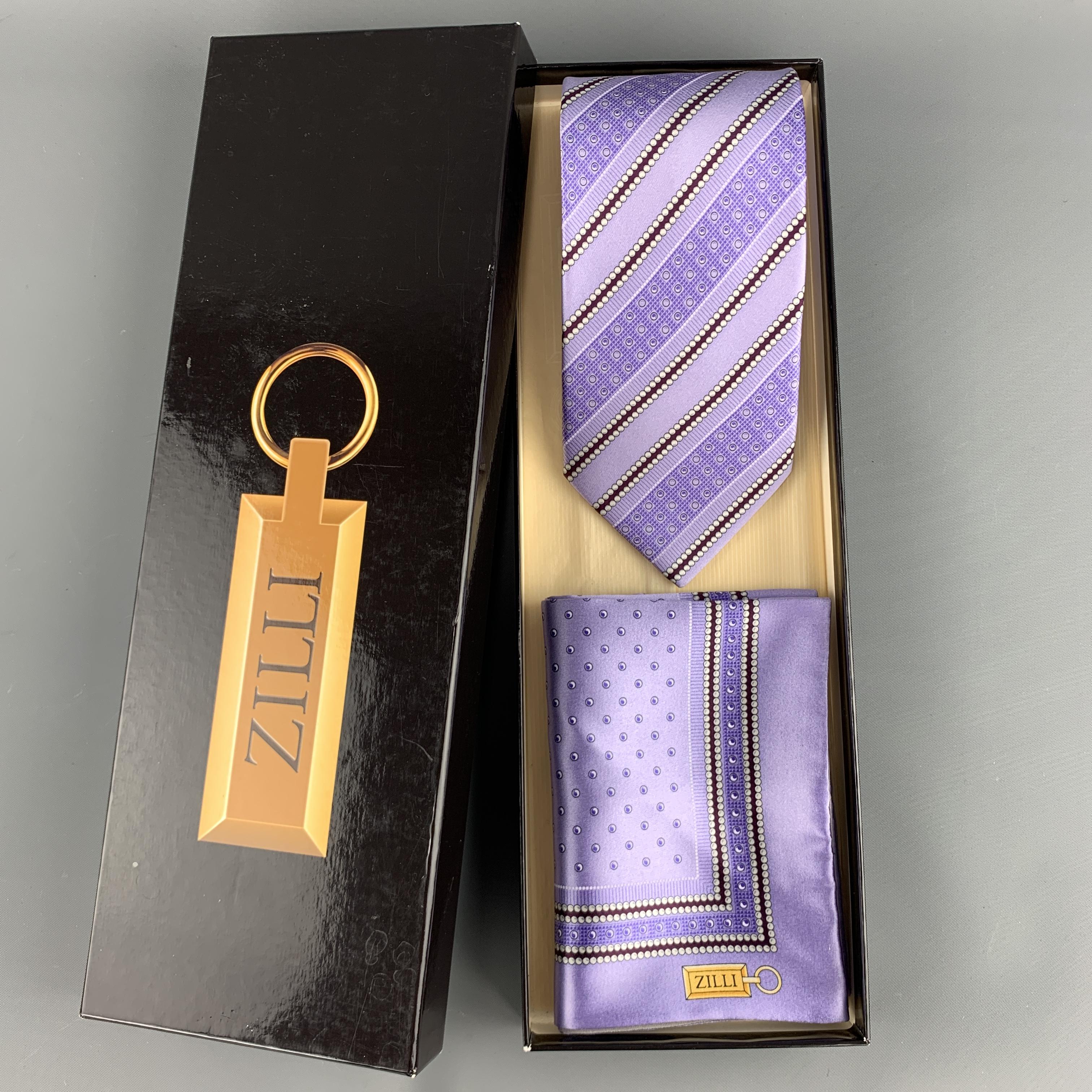 Vintage ZILLI set includes a classic tie and matching lined pocket square in a spotted, diagonal striped silk satin. Hand made in Italy. 

New with Box.

Tie Width: 3.75 in.
Pocket Square. 13 x 13 in.