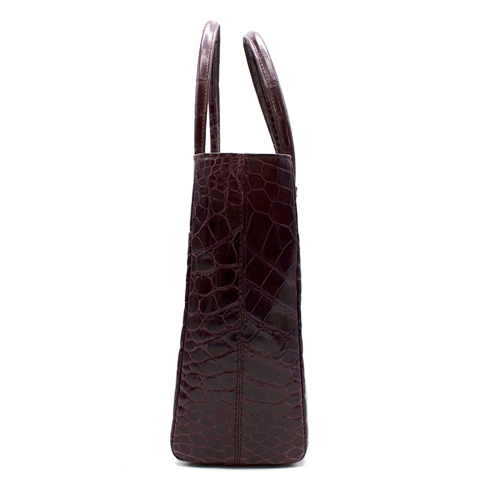Zilli Purple Shiny Crocodile Grande Maroquinerie Bag  

-Classic timeless style
-Luxurious shiny Crocodile leather 
-Rich deep purple hue 
-Branded silver hardware to the front
-2 outer pockets with magnetic fastening 
-Interior devinde in 3