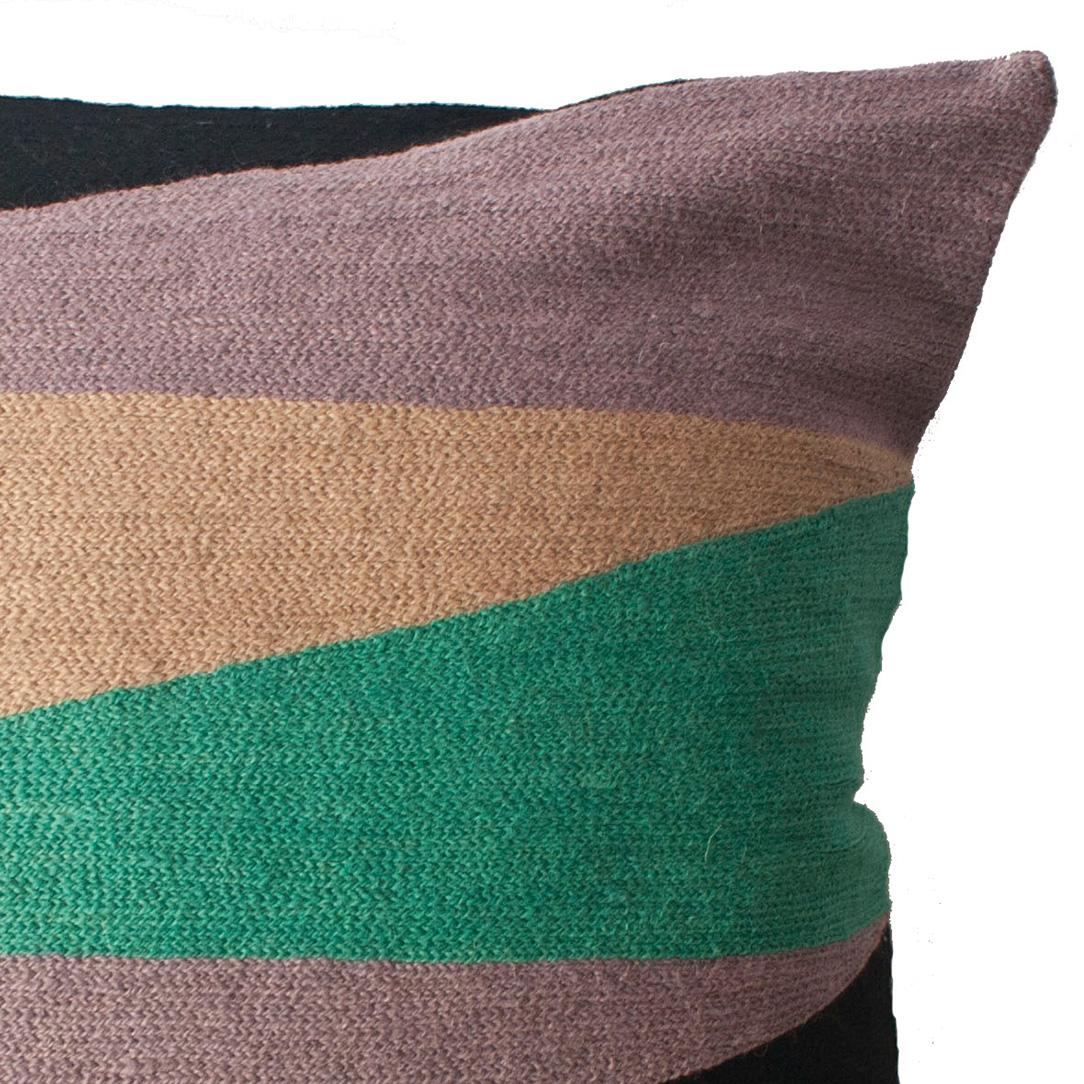 This geometric throw pillow has been ethically hand embroidered by artisans in Kashmir, India, using a traditional embroidery technique which is native to this region.

The purchase of this handcrafted pillow helps to support the artisans and