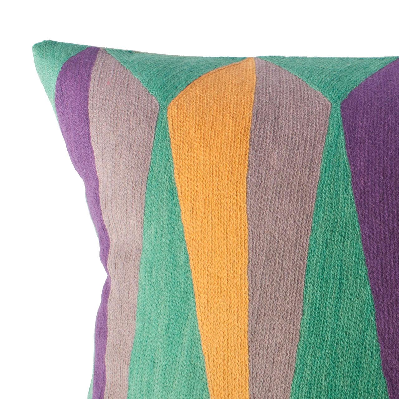 This geometric throw pillow has been ethically hand embroidered by artisans in Kashmir, India, using a traditional embroidery technique which is native to this region.

The purchase of this handcrafted pillow helps to support the artisans and