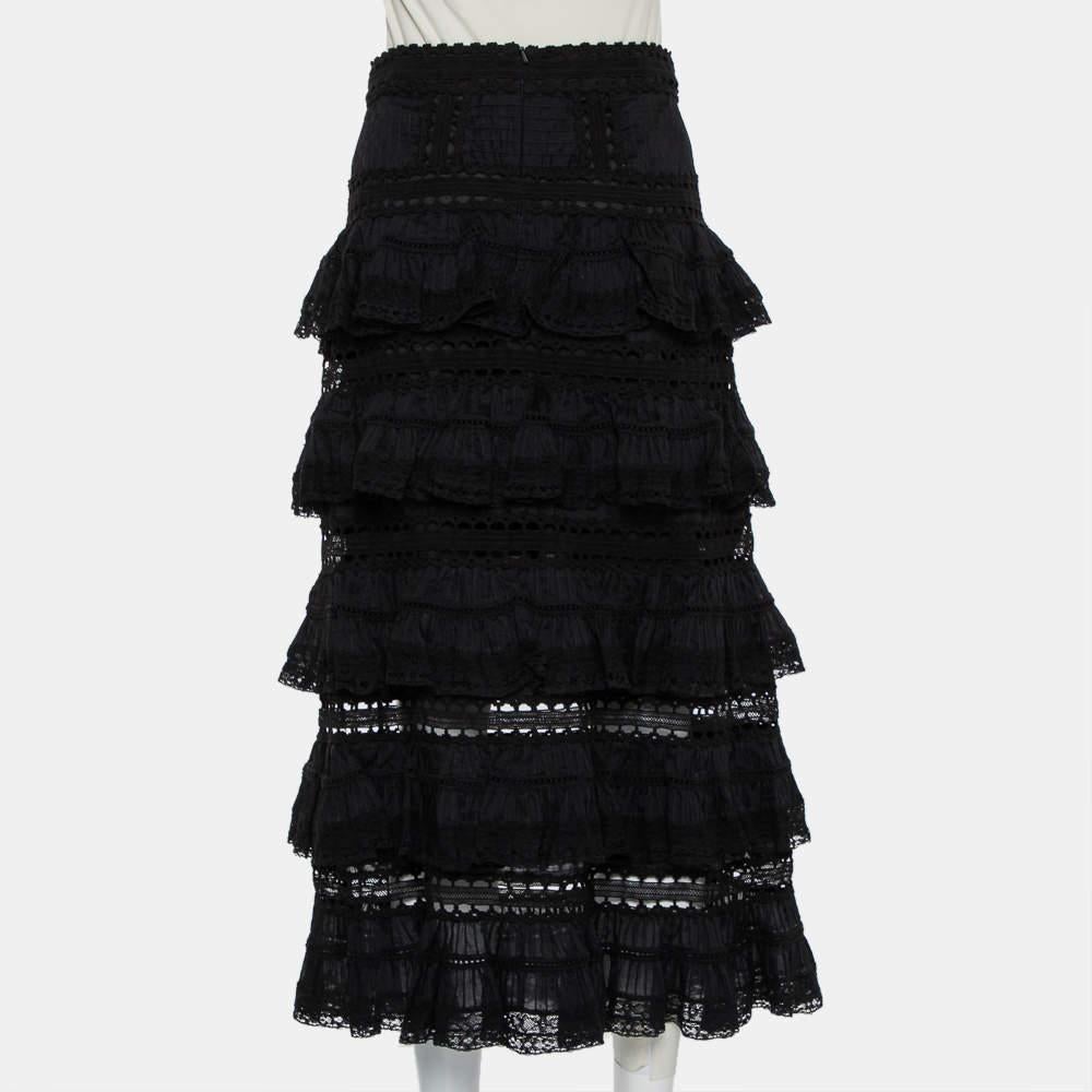 Coming from the house of Zimmerman, this chic skirt can help you create a chic statement look. Sewn will panels of dainty lace in a black shade, they feature a feminine tiered pattern that will flounce with every step you take. Style it with a