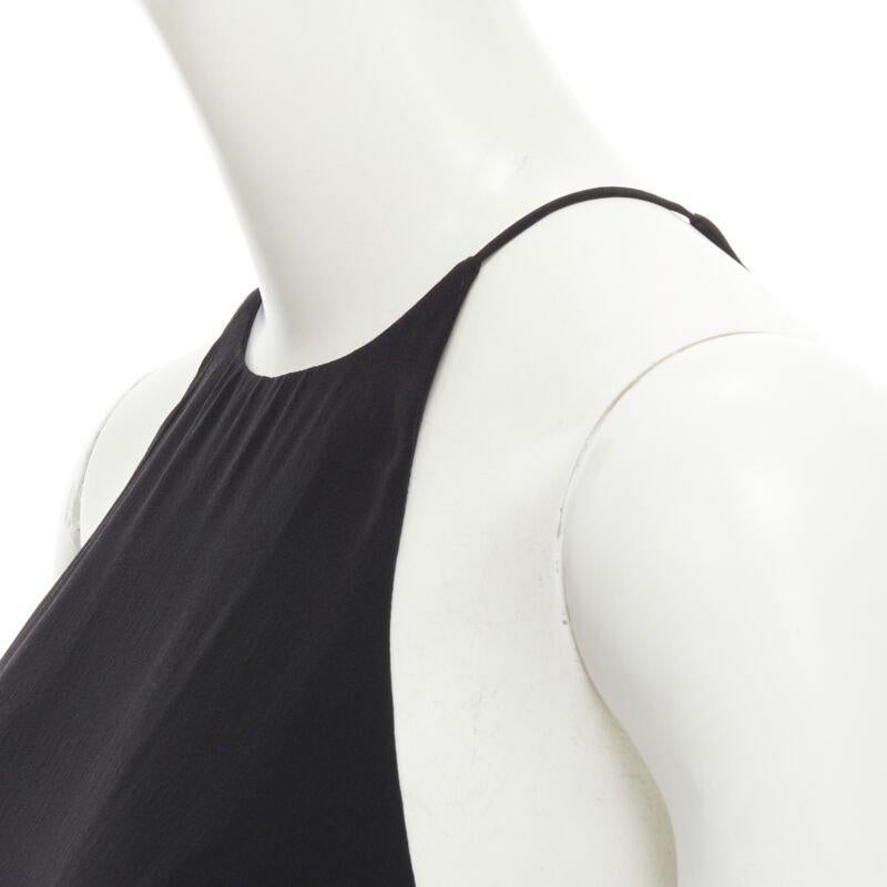 ZIMMERMANN 100% silk black racerback rounded hem tank top US0 XS
Reference: KEDG/A00091
Brand: Zimmermann
Material: Silk
Color: Black
Pattern: Solid
Made in: China

CONDITION:
Condition: Excellent, this item was pre-owned and is in excellent