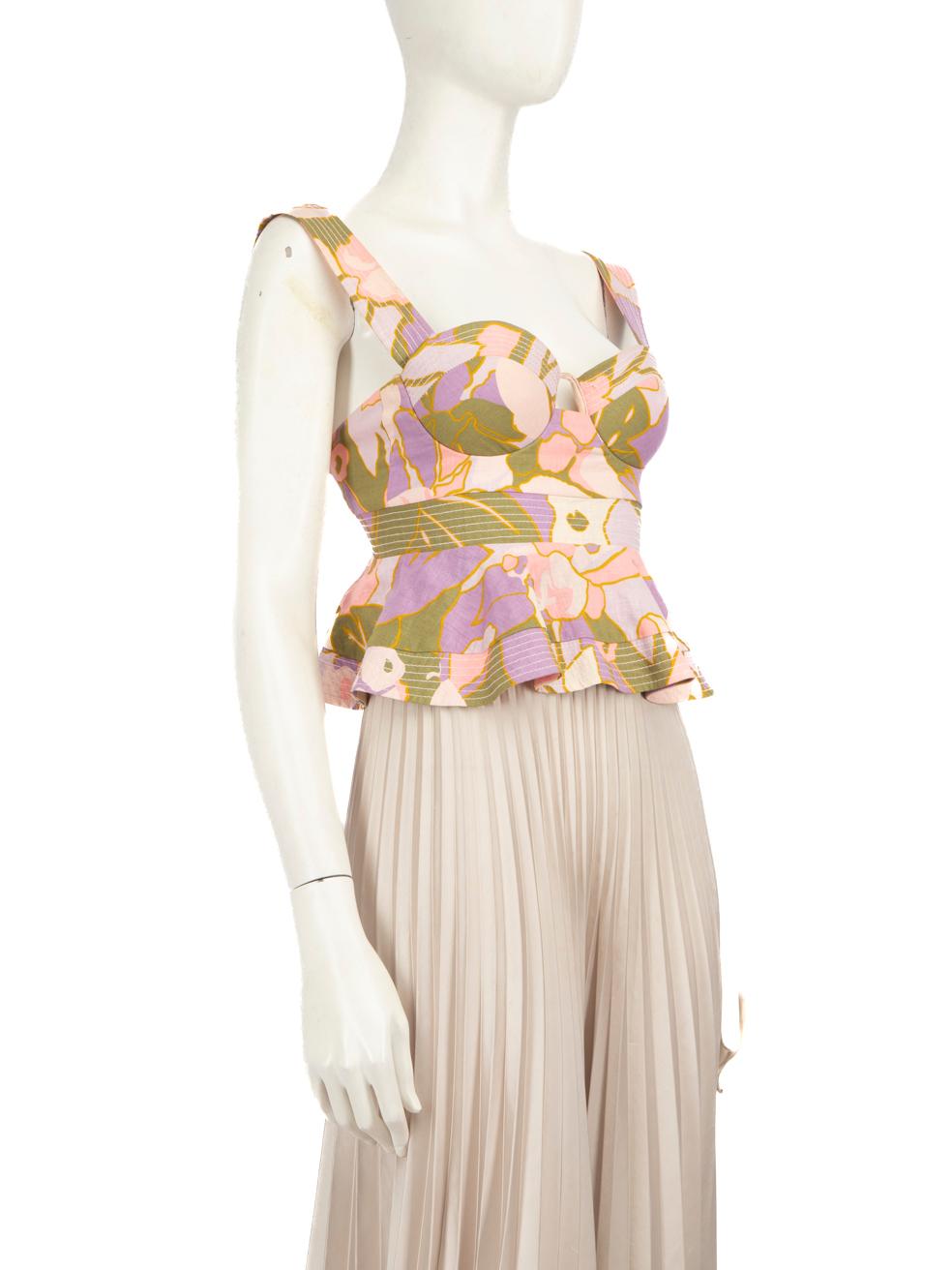 CONDITION is Very good. Minimal wear to the top is evident. Discolouration on both straps, the centre front between the cups and on the lining of both cups. Pluck to the weave on the left cup on this used Zimmermann designer resale item.
