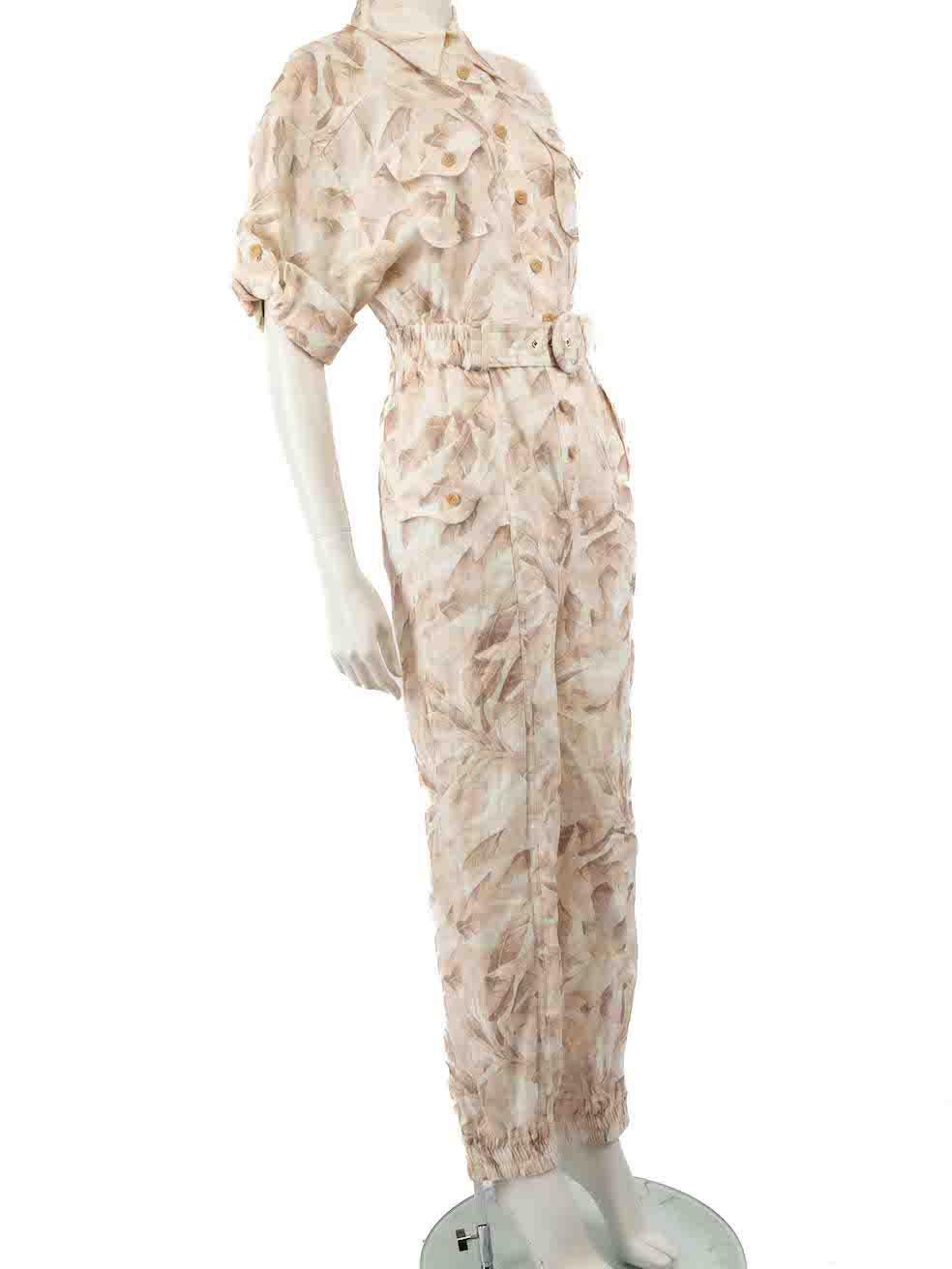 CONDITION is Very good. Hardly any visible wear to jumpsuit is evident on this used Zimmermann designer resale item.
 
 
 
 Details
 
 
 Beige
 
 Linen
 
 Jumpsuit
 
 Leaf print
 
 Short sleeves
 
 Button up fastening
 
 Belt detail
 
 Elasticated