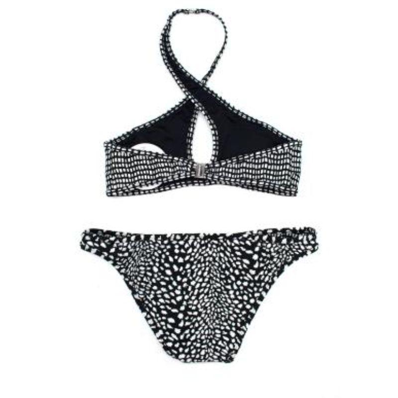 Zimmerman Black and White Patterned Bikini

Top
- Halterneck
- Lined
- Silver-toned buckle fastening by neck and back

Bottom
- Reversible
- Brazilian

Material 
Polyamide

PLEASE NOTE, THESE ITEMS ARE PRE-OWNED AND MAY SHOW SIGNS OF BEING STORED