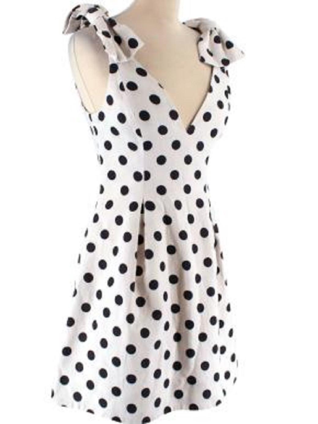 Zimmermann Black and White Polka Dot Linen Mini Dress

- Mid weight 
- All over polka dot pattern 
- Oversized bow shoulder detail 
- V neckline 
- Fitted body with A line skirt 
- Fully lined with white silk
- Back zip