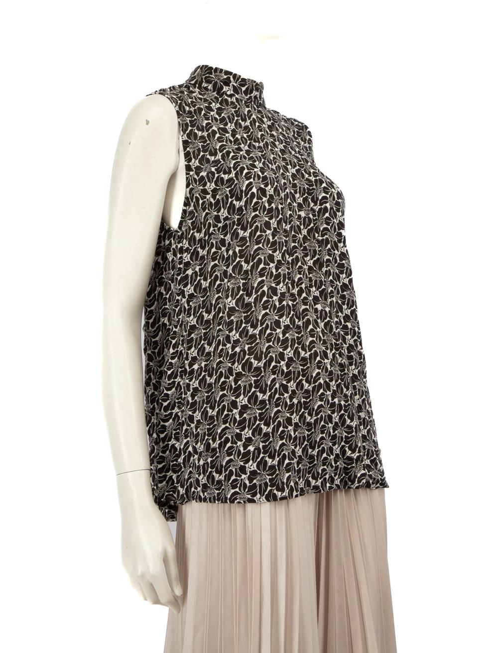 CONDITION is Very good. Hardly any visible wear to dress is evident on this used Zimmermann designer resale item.
 
 Details
 
 
 Black
 
 Viscose
 
 Blouse
 
 Sleeveless
 
 Floral pattern
 
 Mock neck
 
 Back zip fastening
 
 
 
 
 
 Made in China
