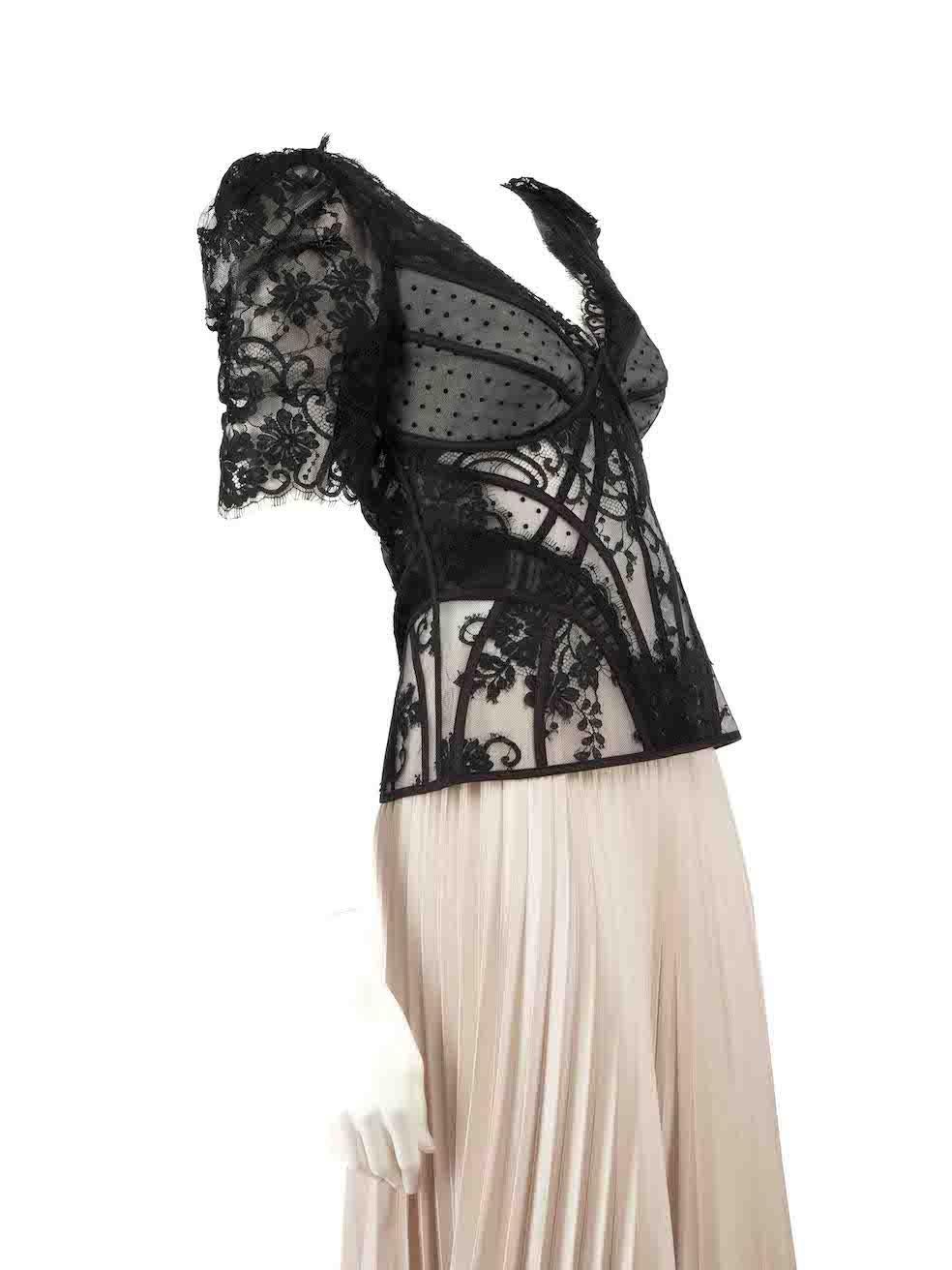 CONDITION is Very good. Hardly any visible wear to top is evident on this used Zimmermann designer resale item.
 
Details
Black
Lace
Top
Gathered short sleeves
See through
Structured netting underlay
 V-neck
 Back zip fastening
 
Made in China
