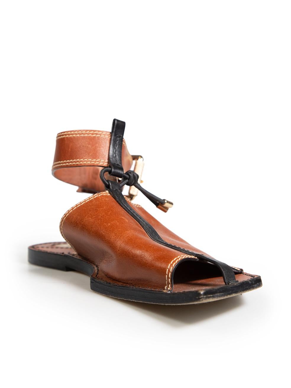 CONDITION is Good. Minor wear to sandals is evident. Light scratches on the upper of the shoes, abrasion to the tips of both shoes on this used Zimmermann designer resale item.
 
 Details
 Brown
 Leather
 Sandals
 Open toe
 Adjustable ankle strap
 
