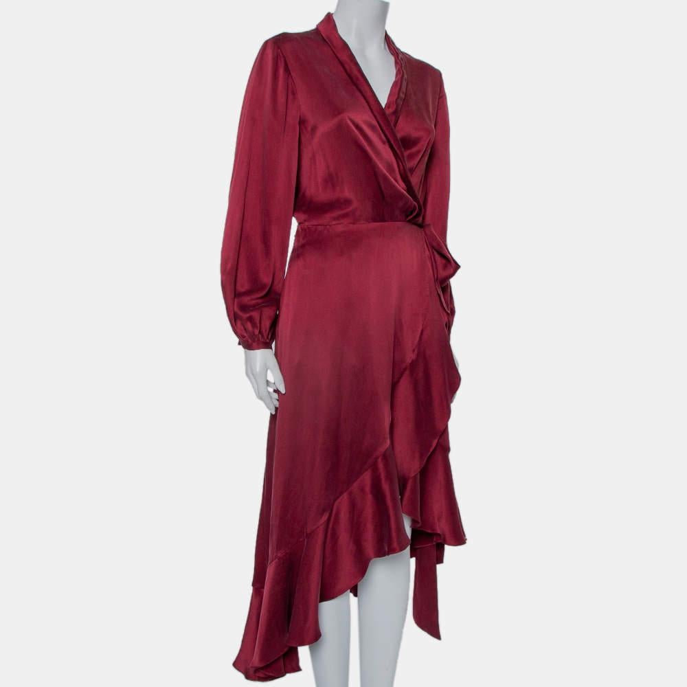 Be the talk of the town when you flaunt this excellent dress from the house of Zimmerman. Be it any event, this pure silk dress in burgundy will be your first choice. it is cut to deliver a wrap silhouette and has long sleeves and a midi