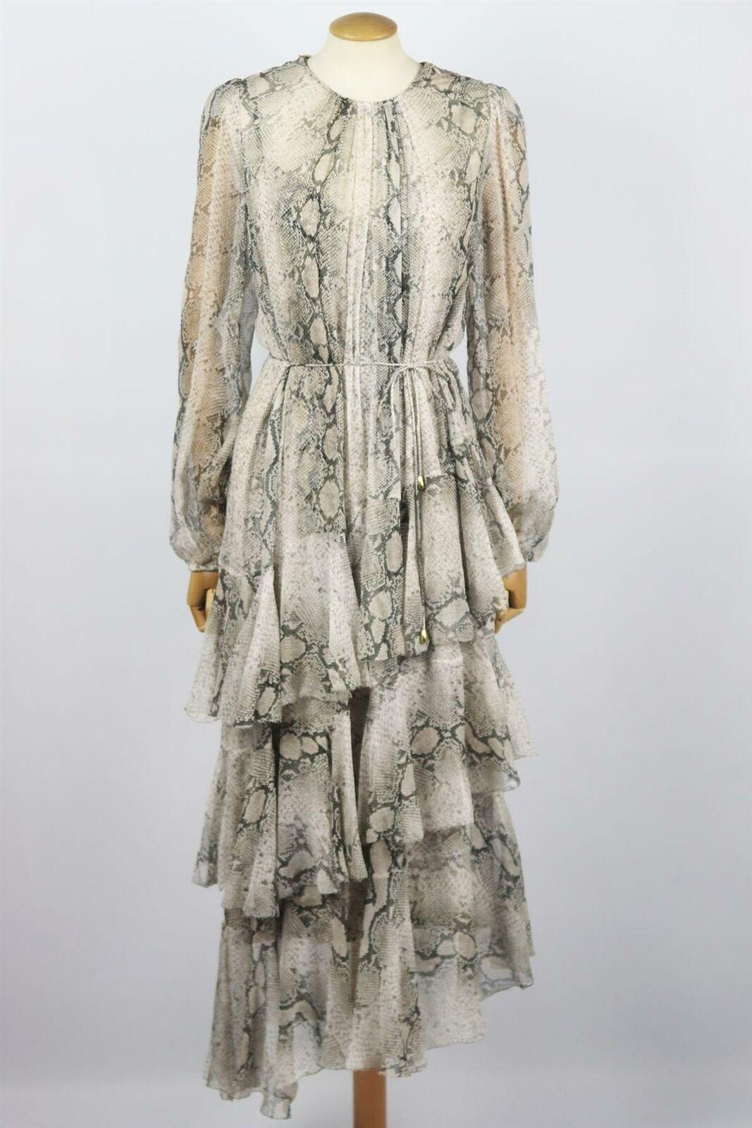 There is an effortless feel to Zimmermann's grey silk 'Corsage' midi dress, it's cut from lightweight silk-chiffon with blouson sleeves and a sweeping asymmetric tiered ruffled skirt, and falls over a separate coordinating jersey slip to offset the