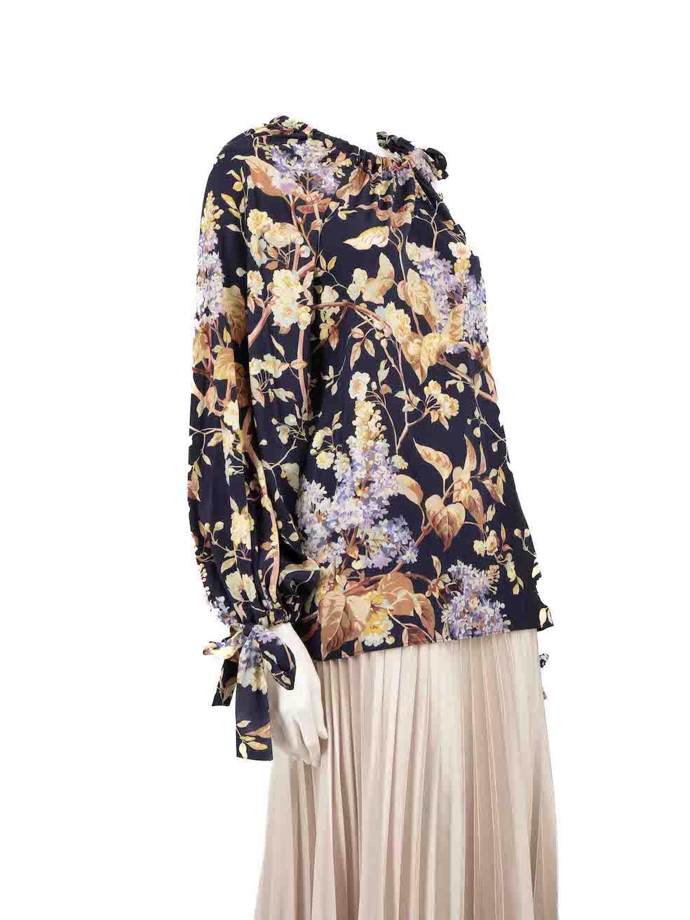 CONDITION is Very good. Hardly any visible wear to the blouse is evident on this used Zimmermann designer resale item.
 
 
 
 Details
 
 
 Multicolour- navy tone
 
 Silk
 
 Blouse
 
 Floral print
 
 Long puff sleeves
 
 Drawstring cuffs
 
