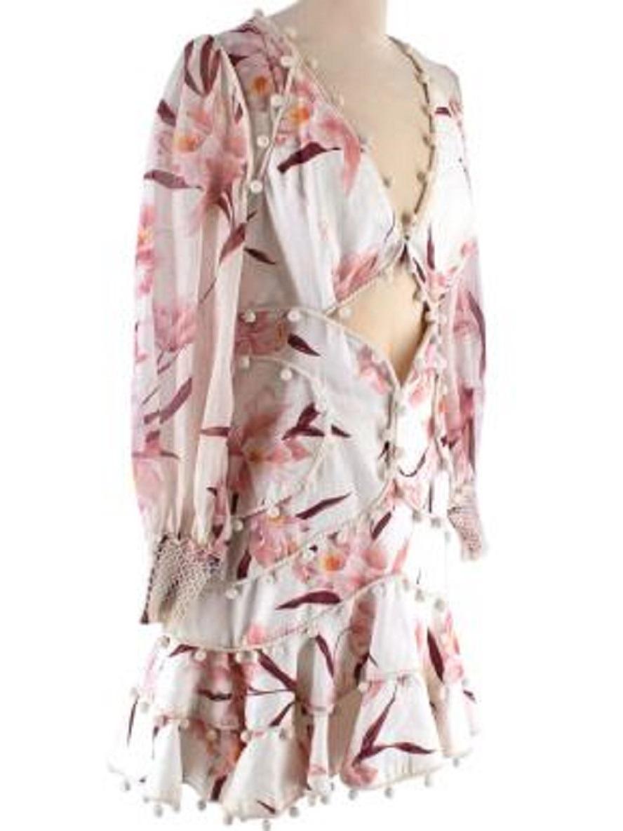 Zimmermann Floral Printed Cream Linen Mini Dress

- Mid weight linen body 
- All over pink floral print 
- Bobble trims 
- Cut out bustier panel 
- Sheer sleeves with woven cuffs 
- Slim fitting with skater skirt 
- Back zip fastening 
- Fully lined