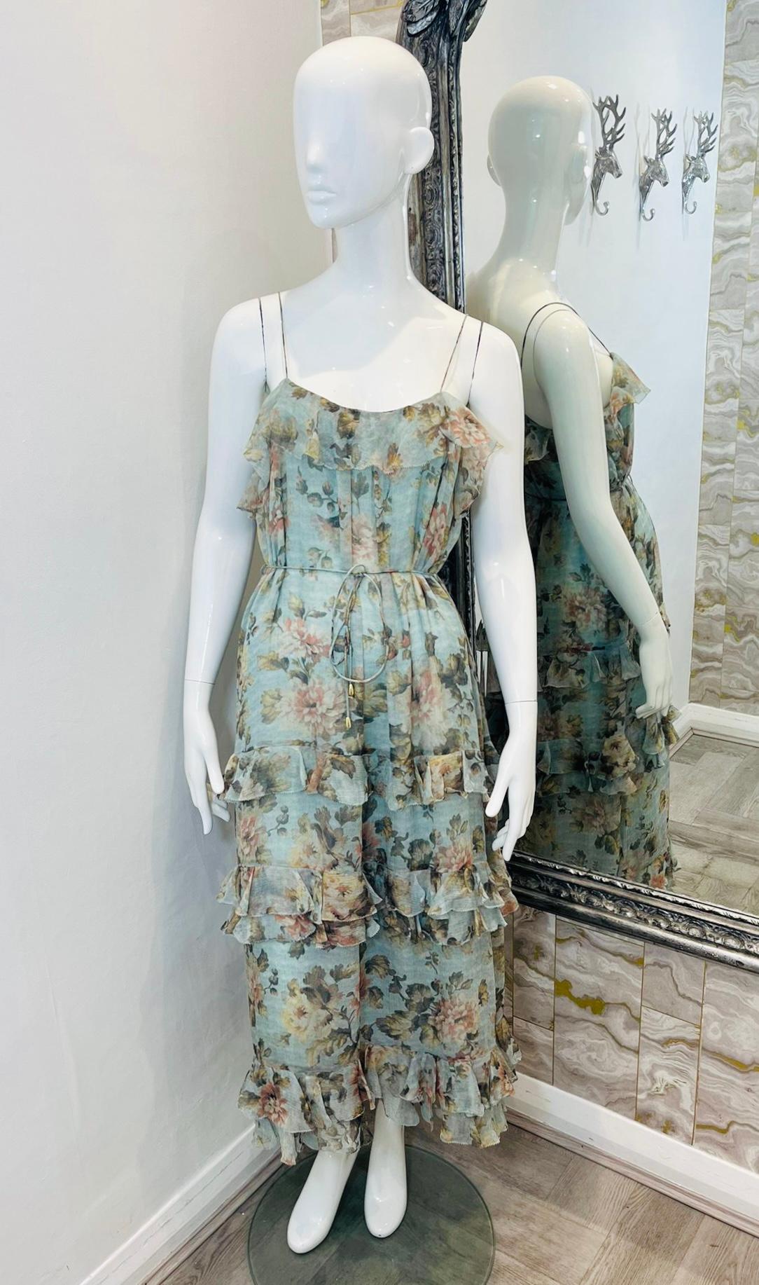 Zimmermann Frill Tiered Silk Dress

Sky blue, maxi dress designed with muted coloured floral prints.

Detailed with frill tiered skirt and neckline.

Featuring spaghetti straps and self-tied waist.

Size – 1 - S

Condition – Very Good

Composition –