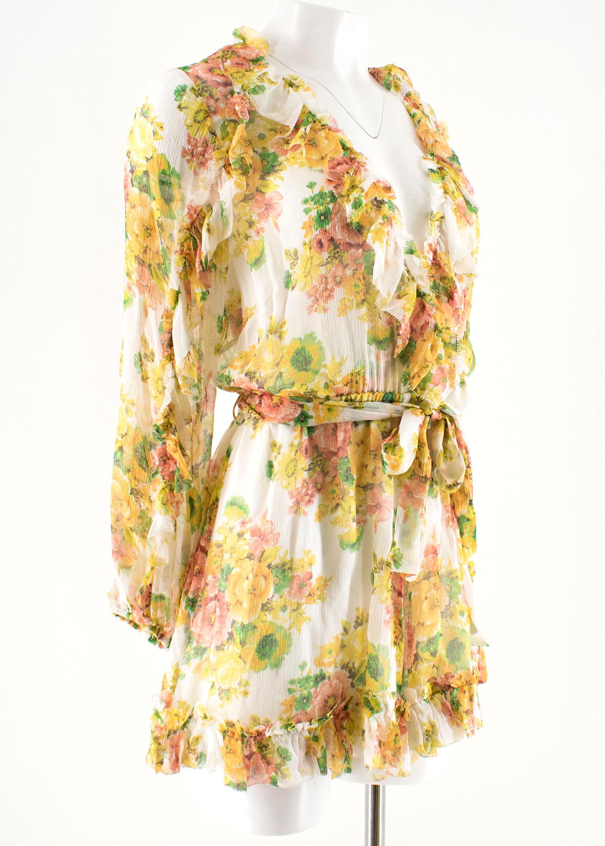 Zimmermann Floral-print Ruffled Silk Playsuit

- Multi-coloured silk playsuit
- Lightweight
- Floral print
- Plunging v-neck
- Long sleeved, elasticated cuffs
- Sheer top
- Ruffled detailing on the collar, sleeves and hem
- Elasticated waist
- Belt