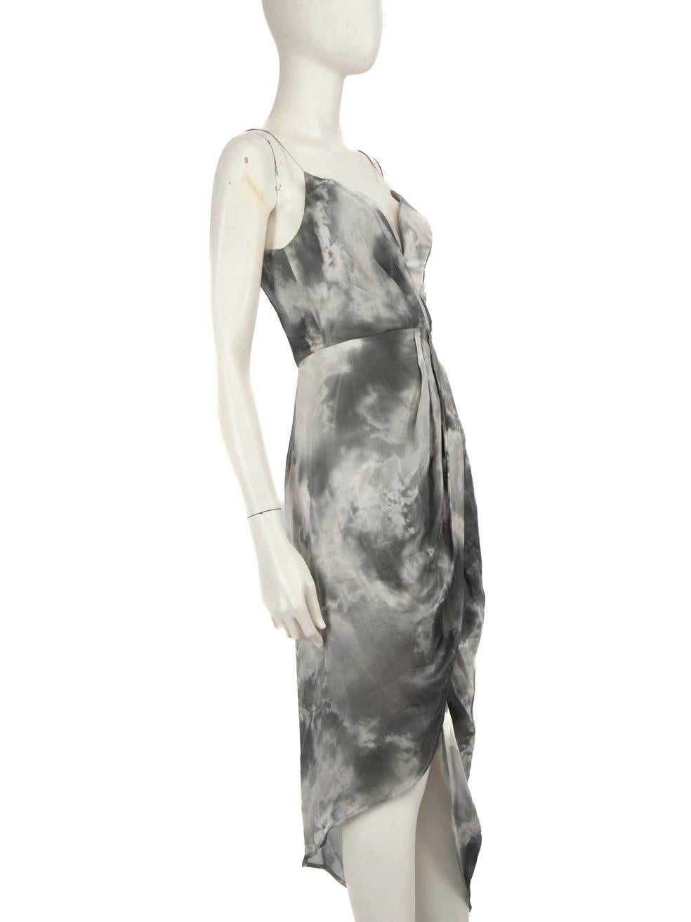 CONDITION is Very good. Minimal wear to the dress is evident. Discolouration on the inside of the dress towards the waist. Pluck to the weave on the centre front towards the neckline and on the left below the waist of this used Zimmermann designer