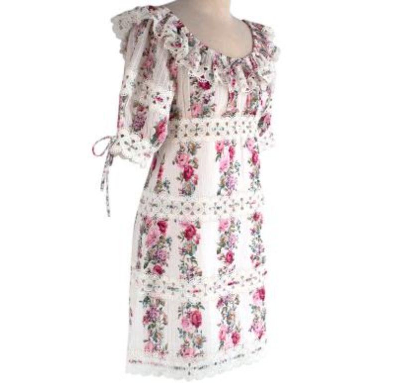 Zimmermann Honour Floral Print Mini Dress

- stretch neckline - can be worn off-shoulder 
- Perfect fitting dress.
- Pink floral print.
- Frilled collar and sleeves. 
- Floral patterns.
- Mid length sleeves.

Made in China. 
Dry clean