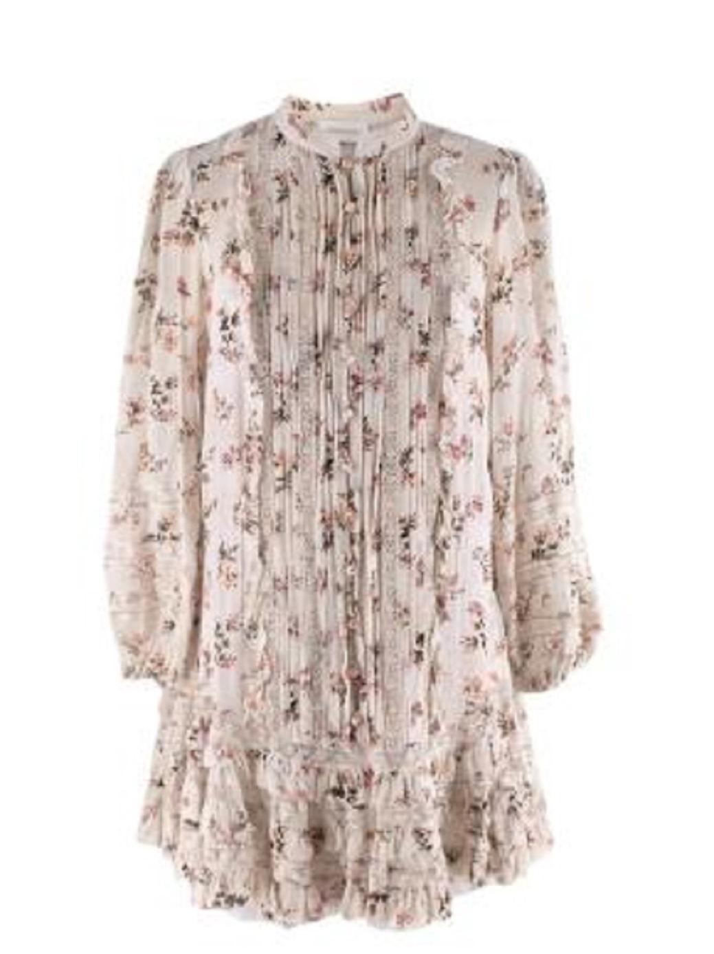 Zimmermann Ivory Floral Chiffon Drop Waist Short Dress

- Lightweight, slightly sheer floral chiffon dress
- Short flippy ruffled hemline, drop-waist silhouette
- Pinktucked, button front bodice and small stand collar
- Long sleeve, button finished
