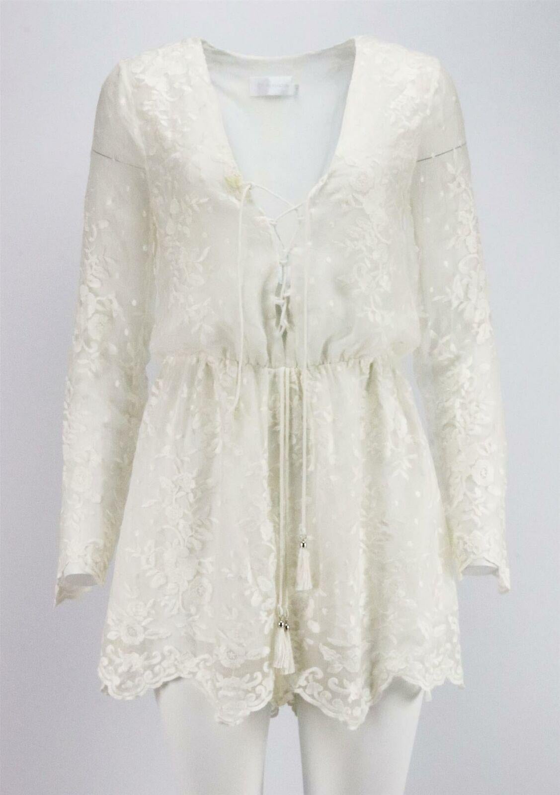 This Lucia playsuit by Zimmermann is made from lightweight ivory embroidered silk-georgette, with a lace-up and elasticated waist to a cinched in waist.
Ivory silk-georgette.
Pull on.
100% Silk; fabric2: 100% cotton; lining: 100% polyester.

Size: 0