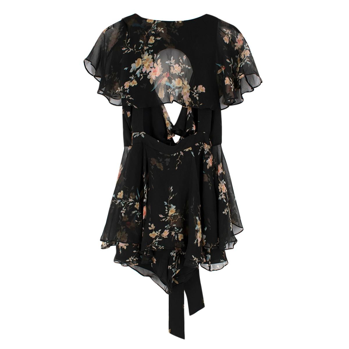 Zimmermann Maples Black Floral Silk Playsuit

Pairing flirty and fun with effortless and relaxed, this playsuit is crafted from lustrous silk base.

- Sheer flutter sleeves
- Layered shorts
- Sheer frills
- V-neckline
- Self-tie waist

Materials: