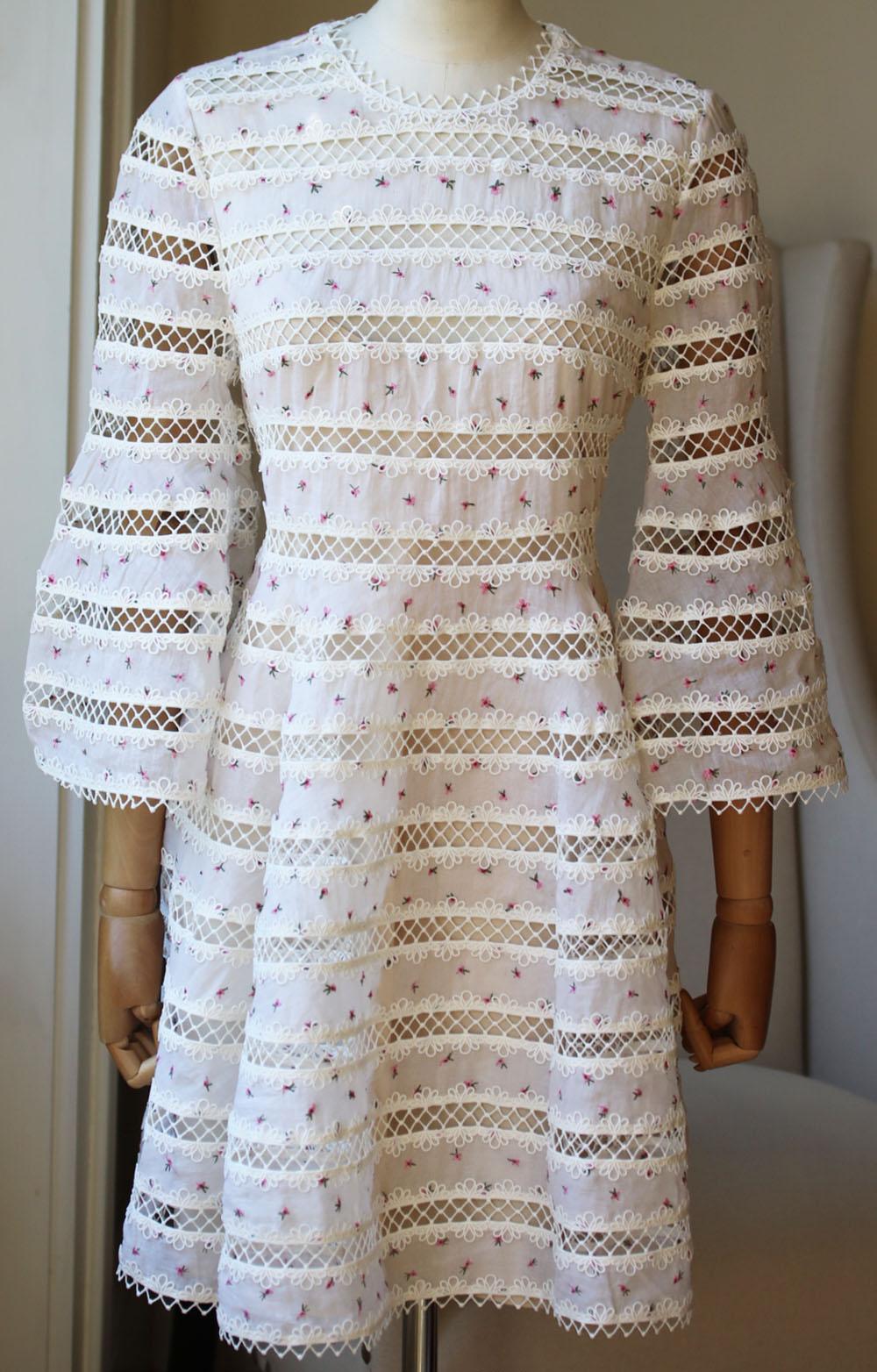 Lattice lace insets join the embroidered panels on this graceful, feminine Zimmermann dress.
The loose, swingy silhouette has thin zigzag edges for a playful finish. 
White floral-print cotton.
Concealed zip fastening down the side.
100% Cotton;