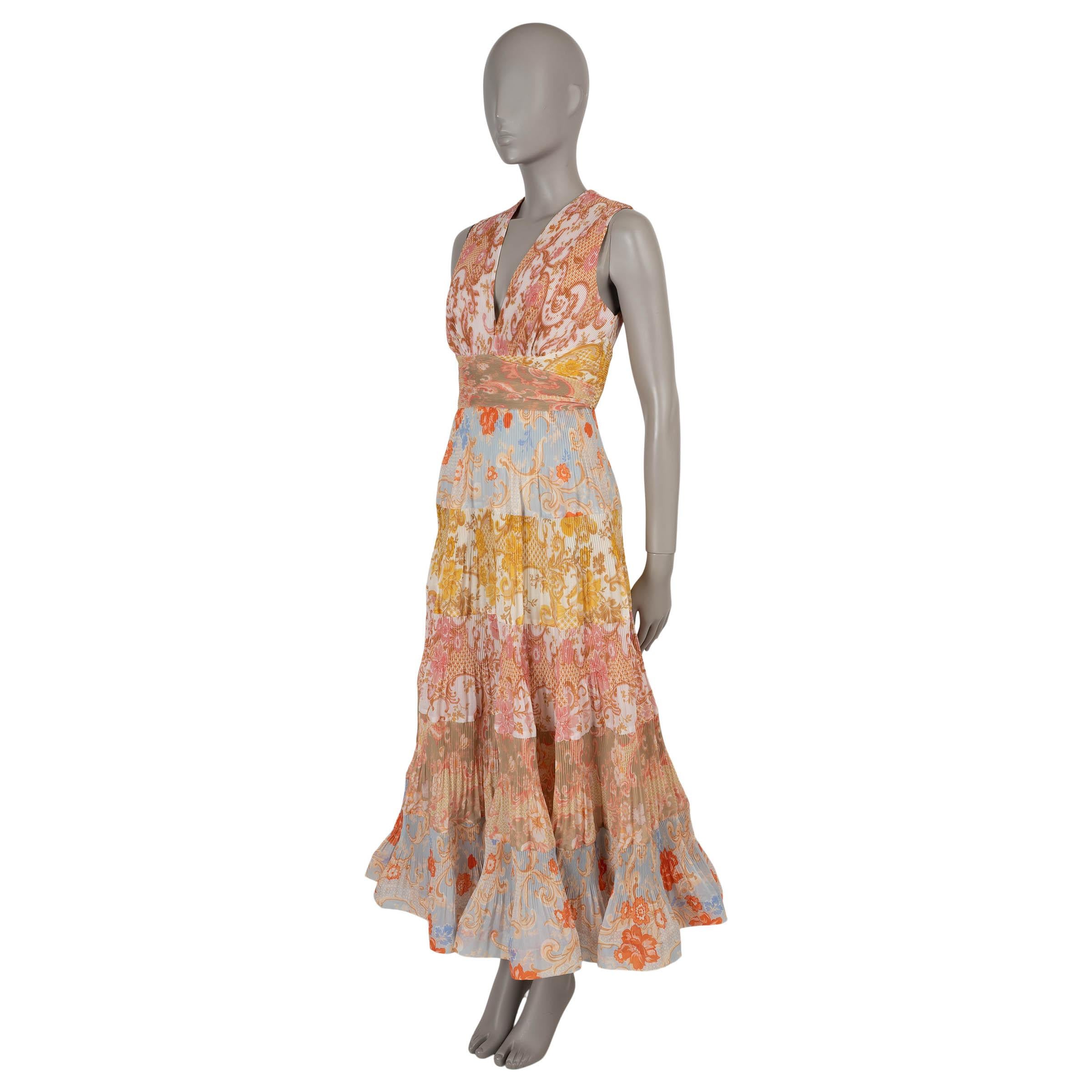 Este vestido Zimmermann Postcard 100% auténtico en poliéster multicolor (100%) captura la elegancia caprichosa característica de la marca con un collage de estampados vibrantes. Diseñado con una silueta ajustada y acampanada, presenta una bonita