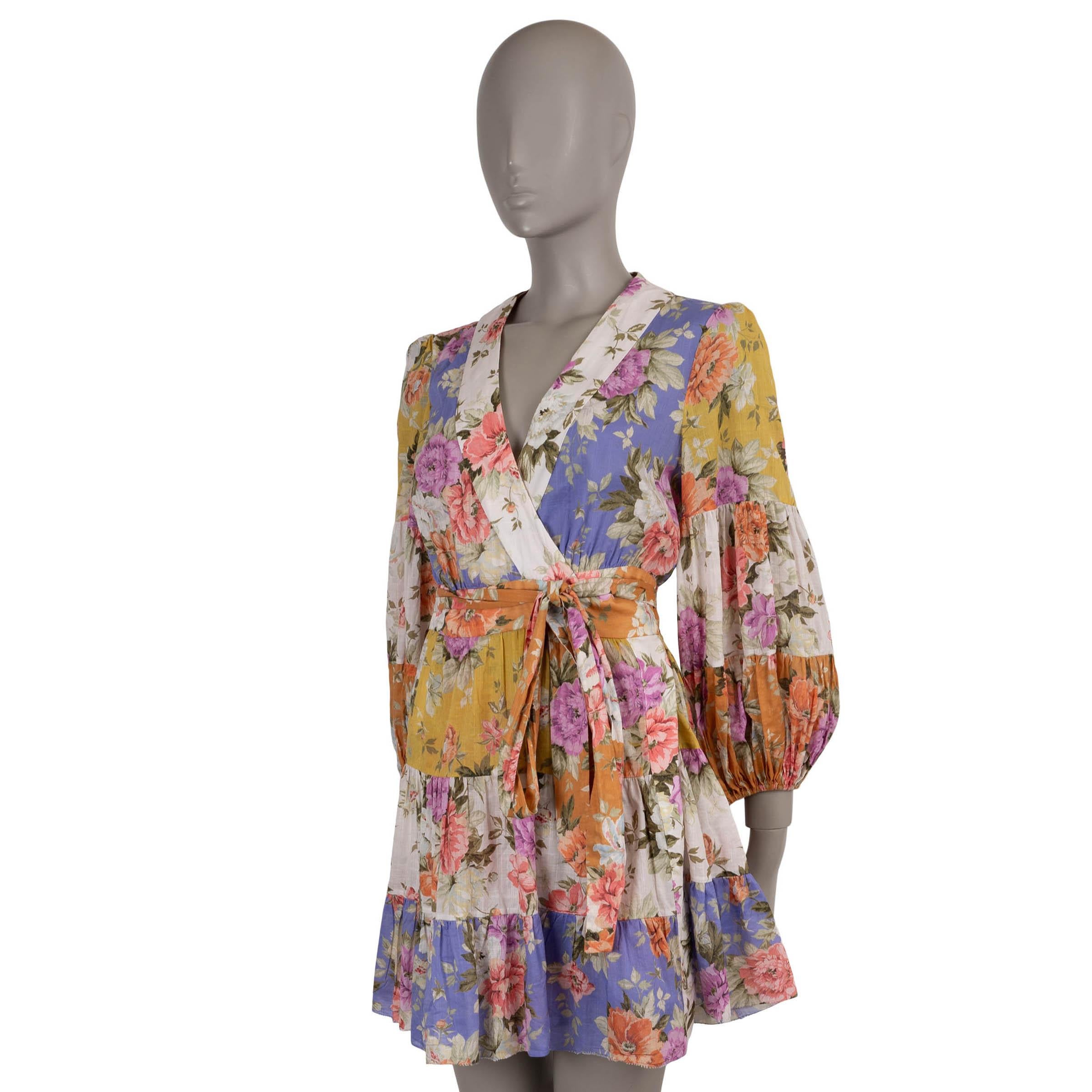 Questo abito a portafoglio Zimmermann Pattie, autentico al 100%, è realizzato in cotone garzato patchwork floreale (100%) nelle morbide tonalità del bianco, lilla, arancione, giallo e rosa. Progettato con una silhouette rilassata e una lunghezza