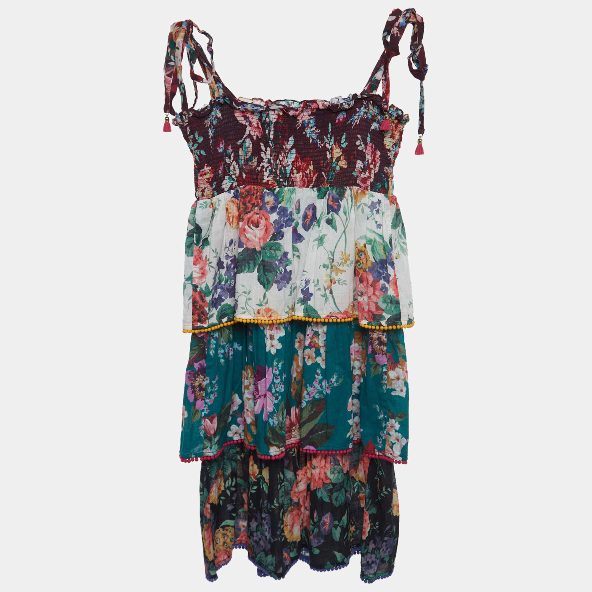 The Zimmermann dress for kids is a vibrant and playful garment featuring a delightful array of colors and patterns. Made from comfortable cotton it boasts a tiered design adding a whimsical touch to this stylish and cheerful childrens dress.