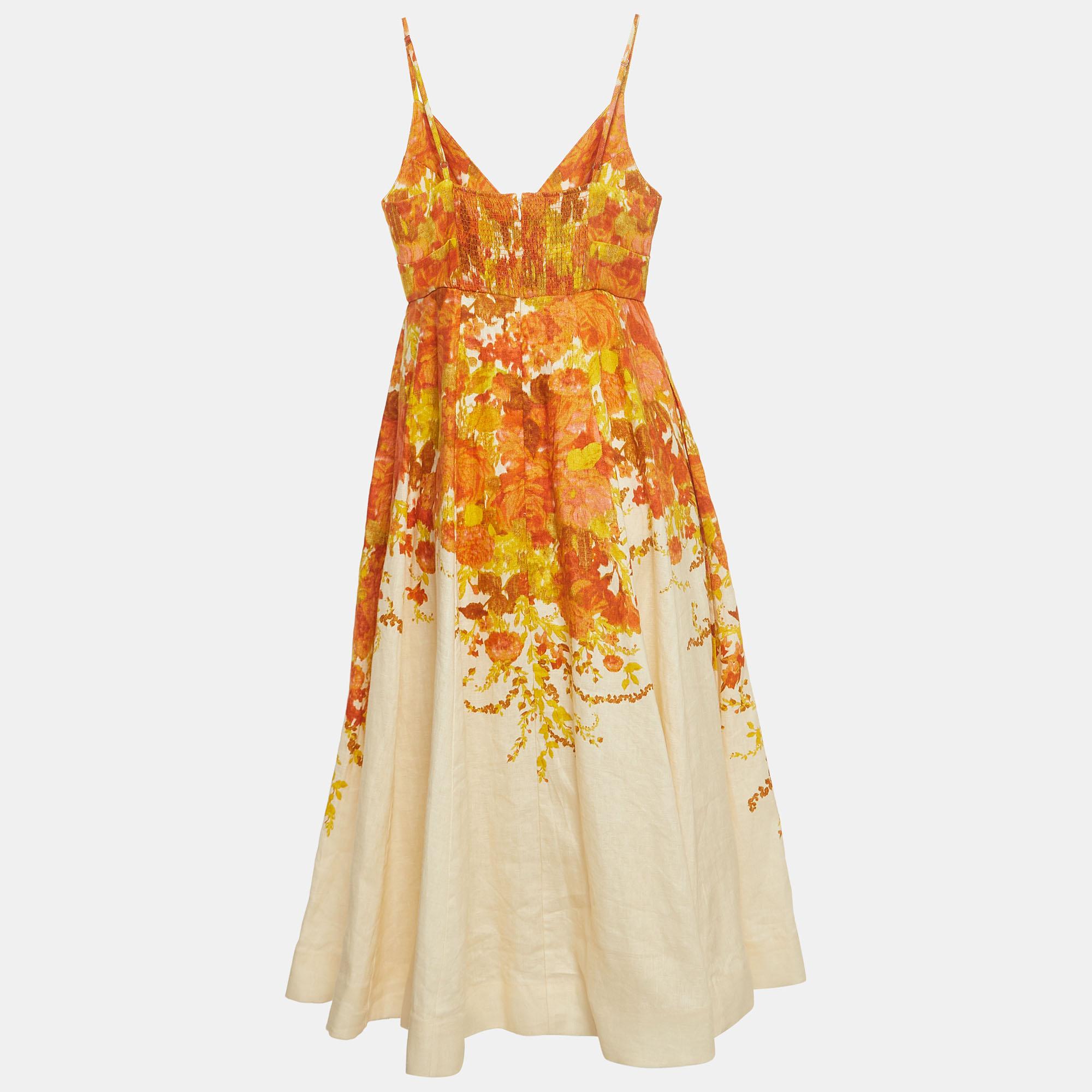 The Zimmermann midi dress is a delightful blend of sophistication and whimsy. Crafted from high-quality linen, the dress features a vibrant orange and cream print that exudes freshness. Its midi length adds a touch of elegance, making it a perfect