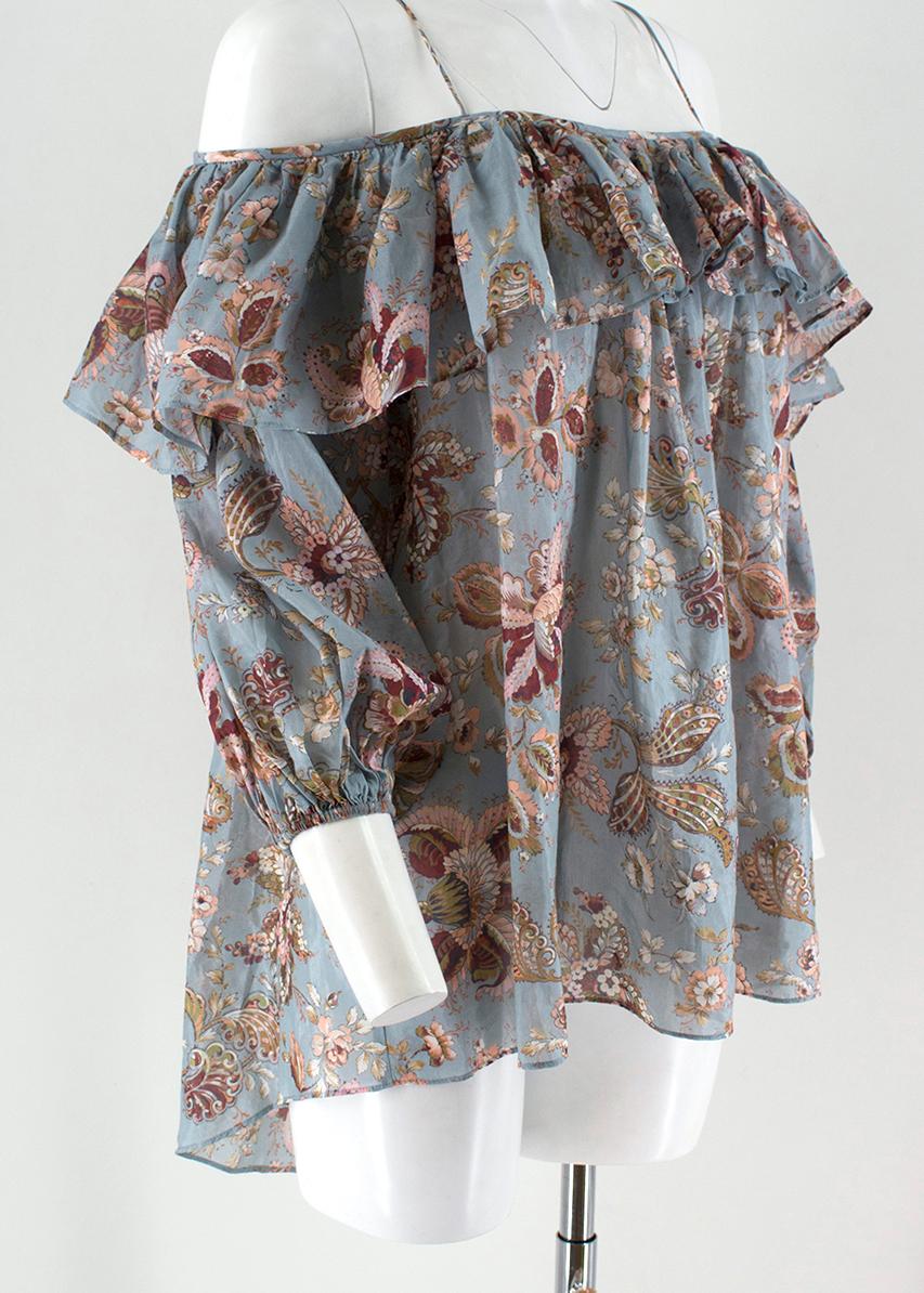 Zimmermann Pavilion off-the-shoulder top

-Blue floral, cotton blend
-open-shouldered long sleeve
-Ruffled around neckline and shoulders
-Spaghetti strapping 

Please note, these items are pre-owned and may show some signs of storage, even when