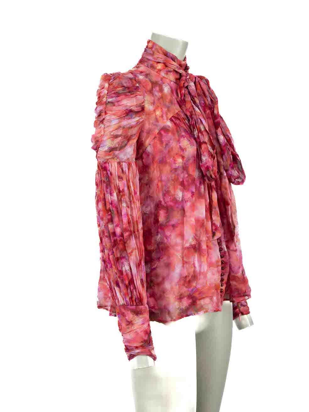 CONDITION is Very good. Minimal wear to blouse is evident. Minimal wear to tie strap where a small hole and loose strings are evident on this used Zimmermann designer resale item.
 
Details
Pink
Viscose
Blouse
Long sleeves
Mock neck
Button up