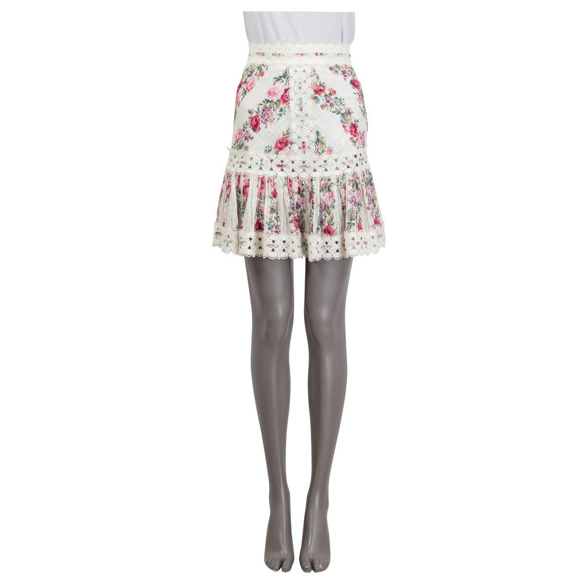 100% authentic Zimmermann 'Honour' ruched mini skirt in off-white, pink, rose, green and petrol cotton (100%). Features a floral print and cut out details at the hemline. Opens with a zipper and a hook at the back. Lined in white polyester (100%).