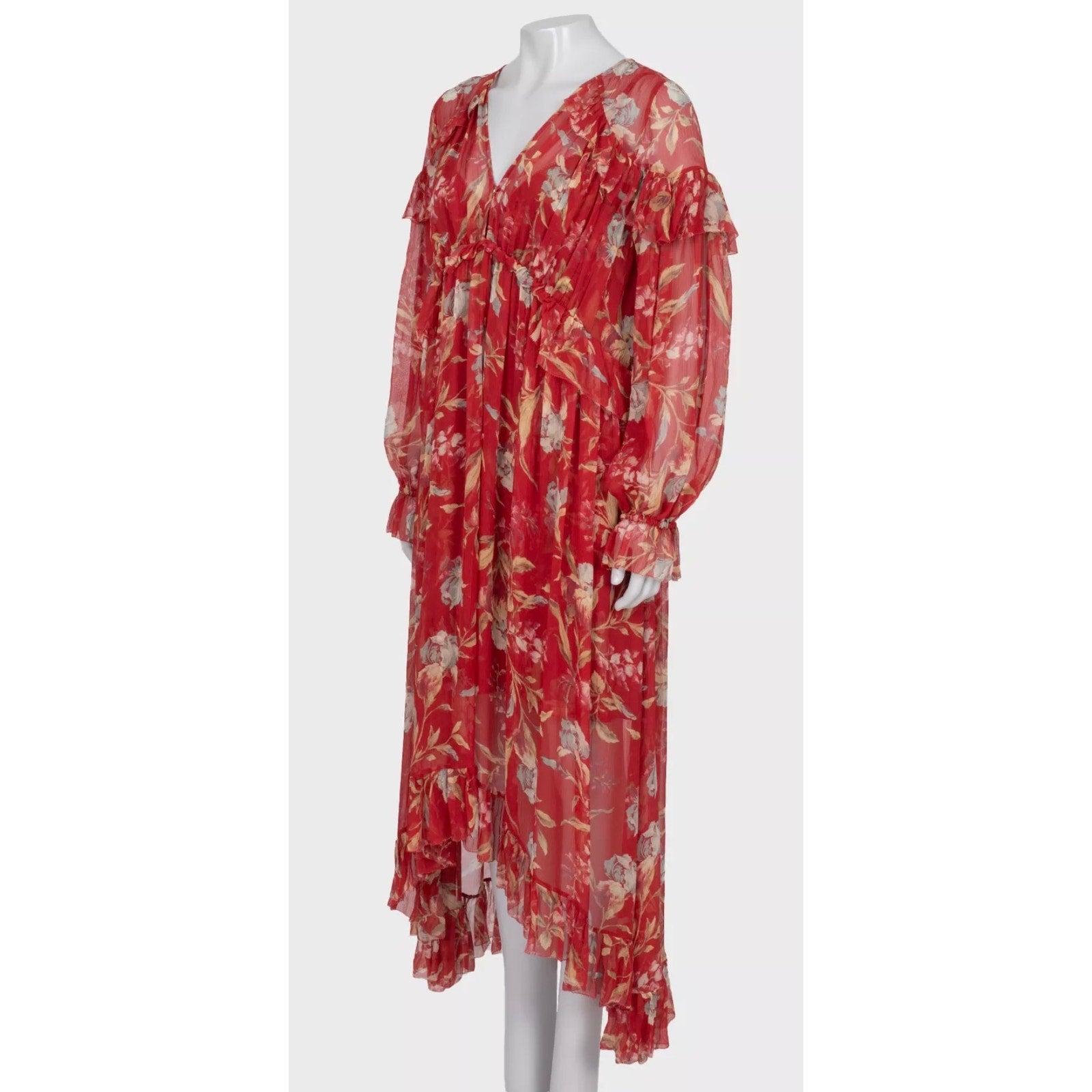 Faites-vous remarquer dans cette superbe robe longue à fleurs rouges de Zimmermann ! Cette robe est une taille L et correspond à la taille de la marque. Il présente une silhouette fluide avec un bel imprimé floral et une fermeture boutonnée sur le